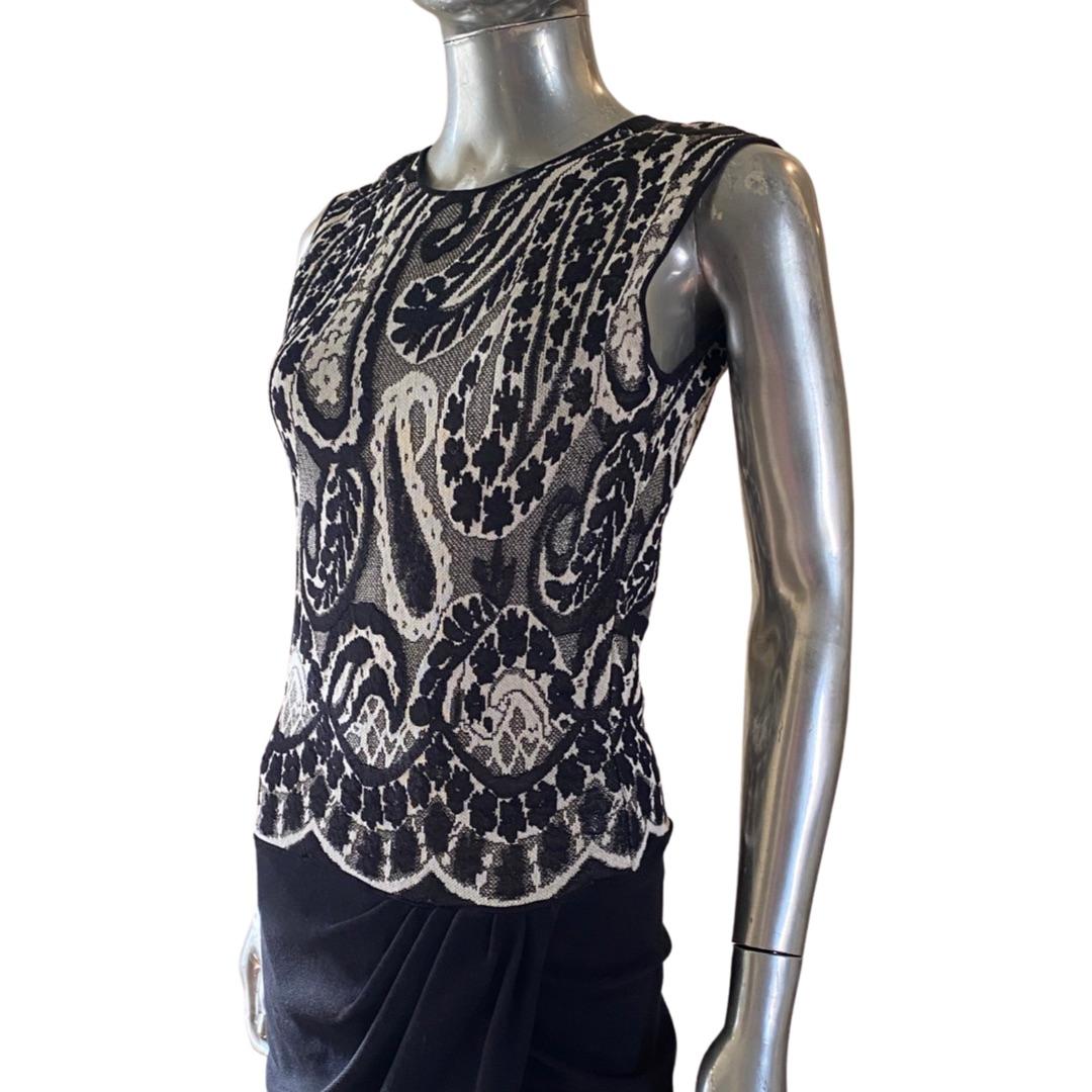 This Giambattista dress is a beautiful knit draped sleeveless dress that has never been worn. Made in Italy. Italian size: 40. US size: XS/ 4. Please see measurements below. Dress has stretch. all measurements done flat. The black and white paisley