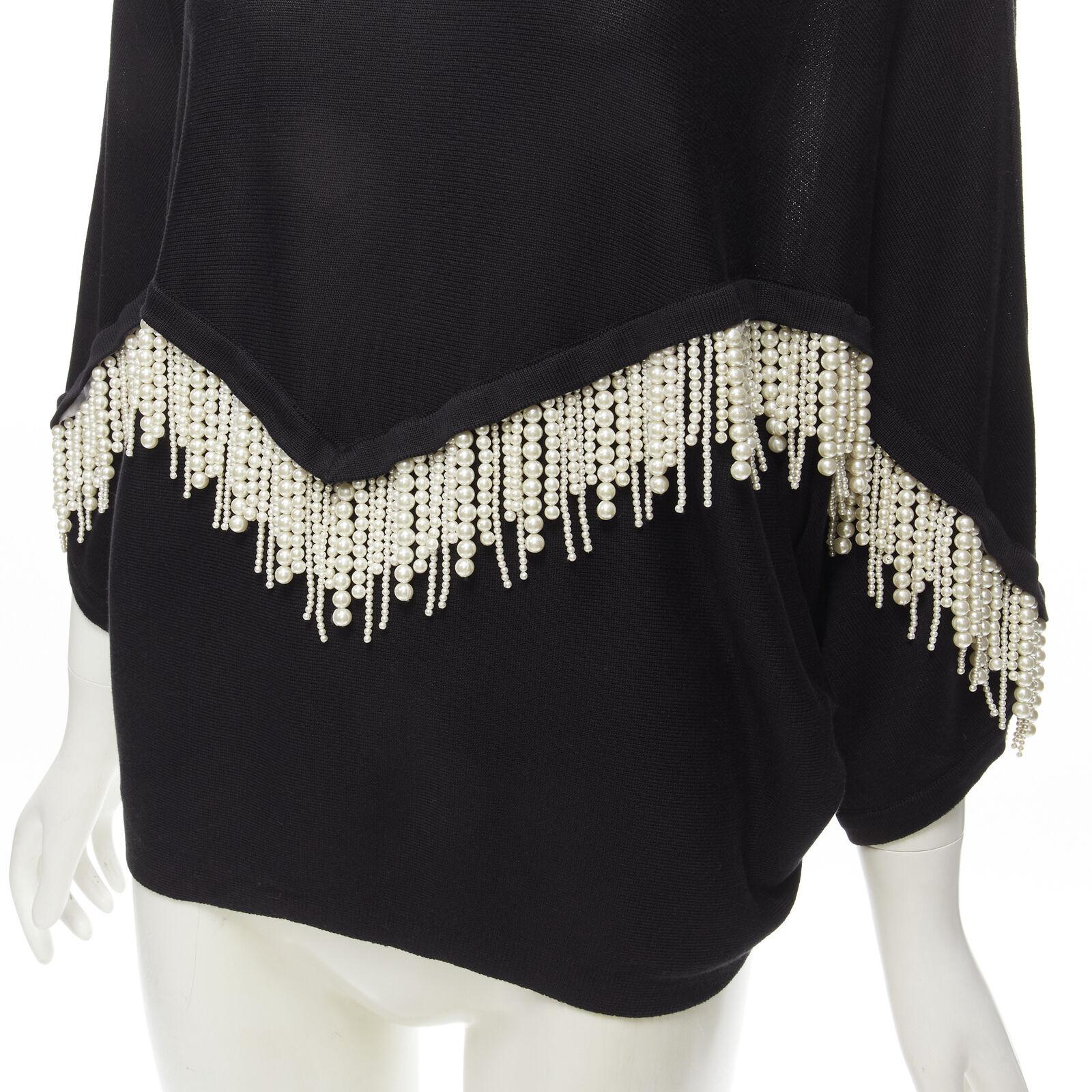 GIAMBATTISTA VALLI black dolman sleeve pearl fringe sweater top IT44 M
Reference: AAWC/A00226
Brand: Giambattista Valli
Designer: Giambattista Valli
Color: Black
Pattern: Solid

CONDITION:
Condition: Excellent, this item was pre-owned and is in