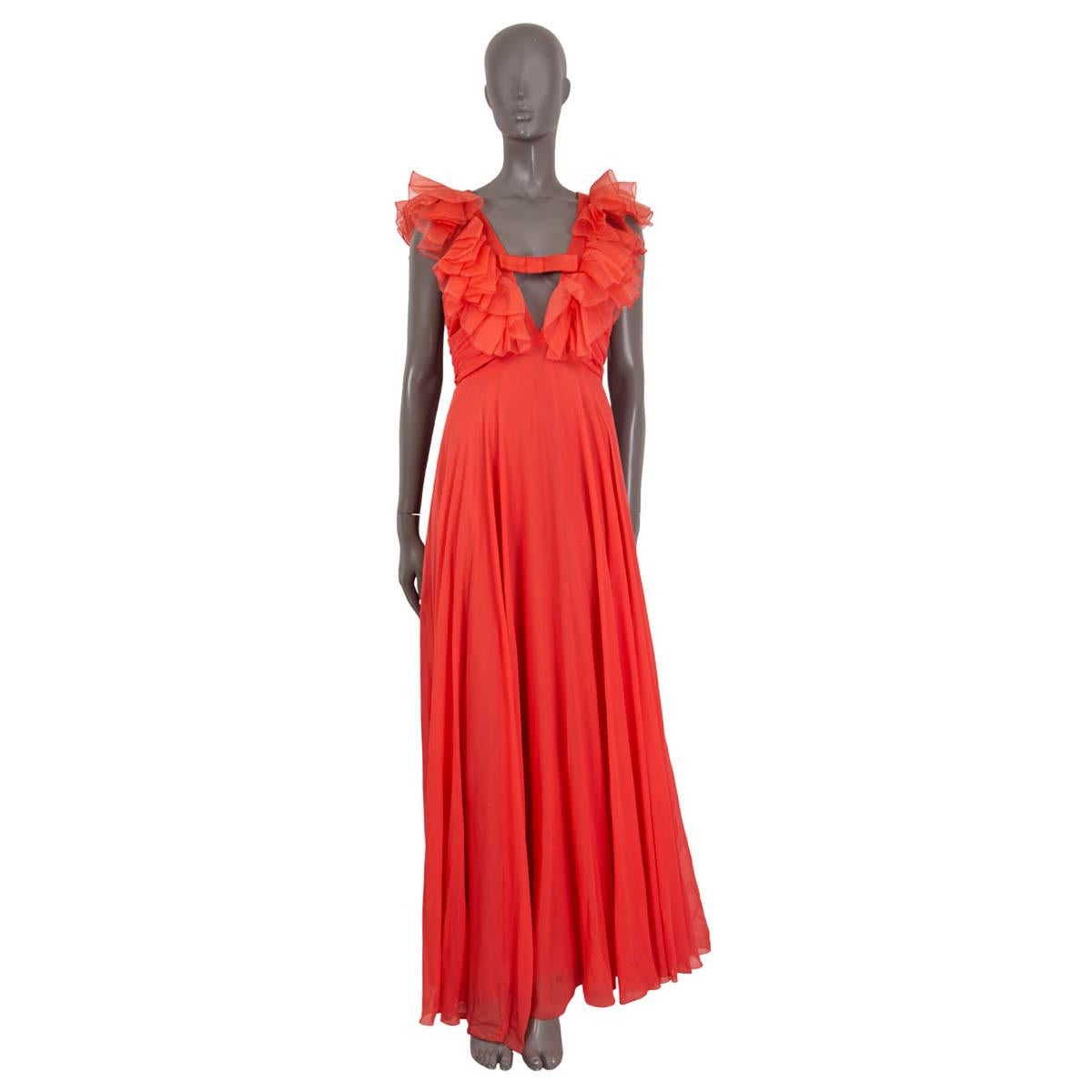 100% authentic Giambattista Valli sleeveless maxi gown in coral pink silk (100%). Features a deep v-neck and ruffle embellishments. Opens with a zipper and a hook on the back. Unlined. Has been worn and is in excellent condition. 

Measurements
Tag
