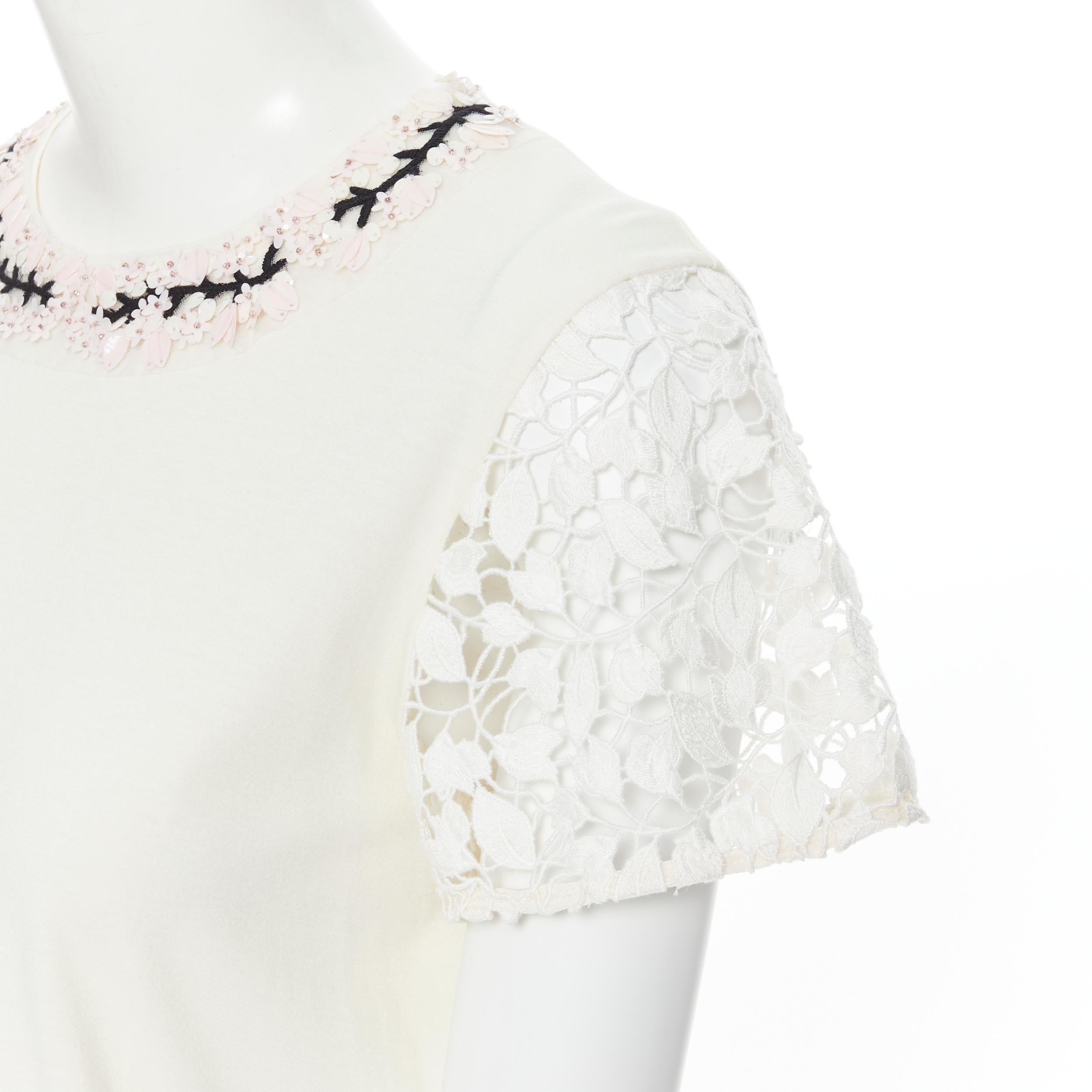 GIAMBATTISTA VALLI cream blossom sequin embellished lace sleeve t-shirt XS 
Reference: LNKO/A01731 
Brand: Giambattista Valli 
Designer: Giambattista Valli 
Material: Cotton 
Color: Beige 
Pattern: Floral 
Extra Detail: Crew neck. Pink blossom
