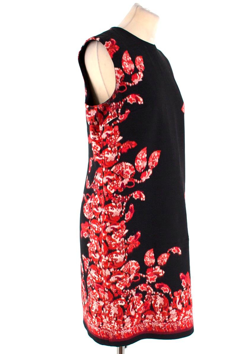 Giambattista Valli Floral Border Printed Shift Dress

- Round neckline
- Sleeveless
- Rear concealed zip fastening
- Silk lining
- Solid black with red floral border patterning around the sides and hem

Please note, these items are pre-owned and may