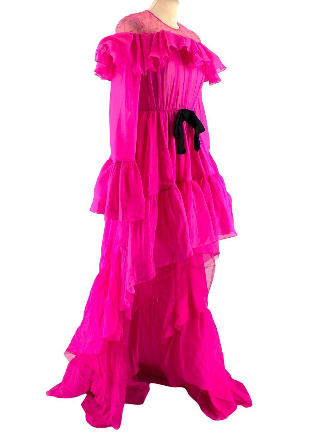 Giambattista Valli Hot Pink Silk Ruffled Gown with Lace Shoulders and Black Bow. Size 38

- Ruffled long sleeves silk gown in hot pink with black waist bow 
- Pink lace shoulder and chest panel
- Long sleeves with flared cuffs
- Boning inside the
