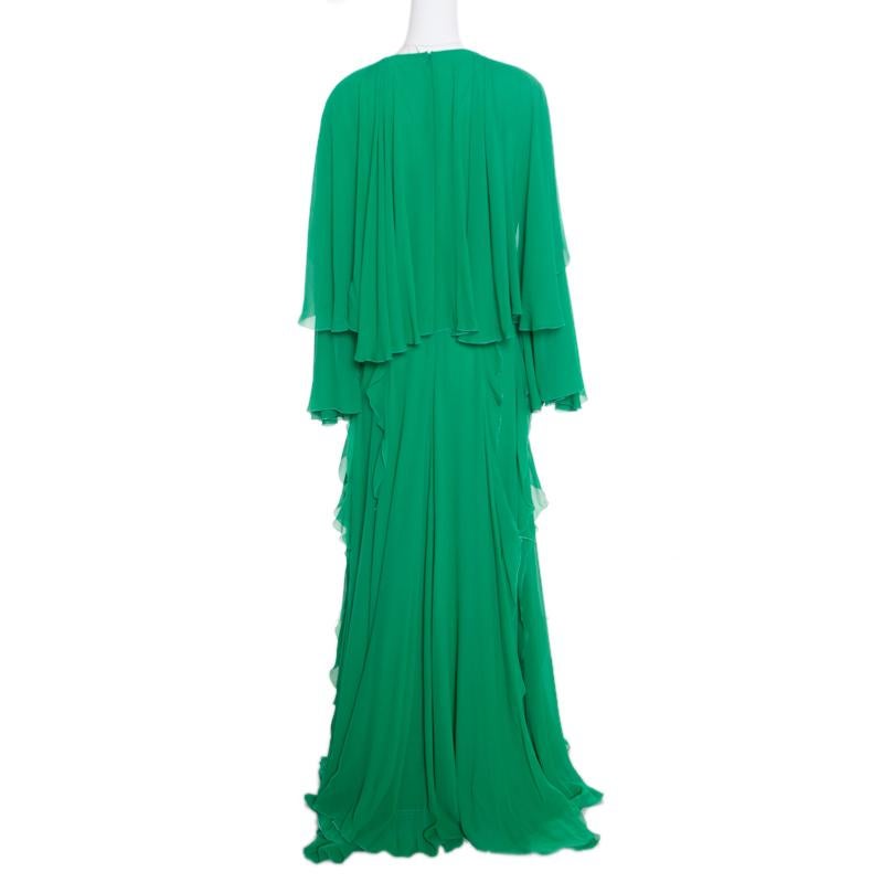 Pick this gown from Giambattista Valli when you want to be an attention grabber at the party. Designed for luxury, this lovely evening gown has a tiered design with pretty ruffles adorned in an eye-catchy kelly green hue. The outfit falls to an