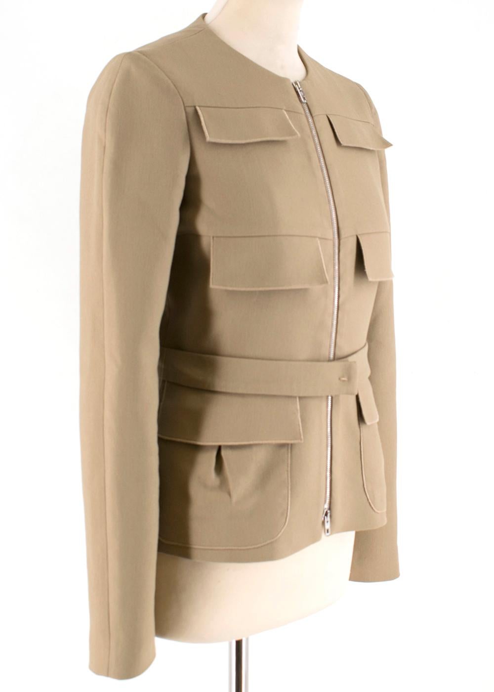Giambattista Valli jacket is designed with utilitarian-style flap pockets. Cut for a slim fit and has a detachable belt to accentuate a smaller waist.

Please note, these items are pre-owned and may show signs of being stored even when unworn and