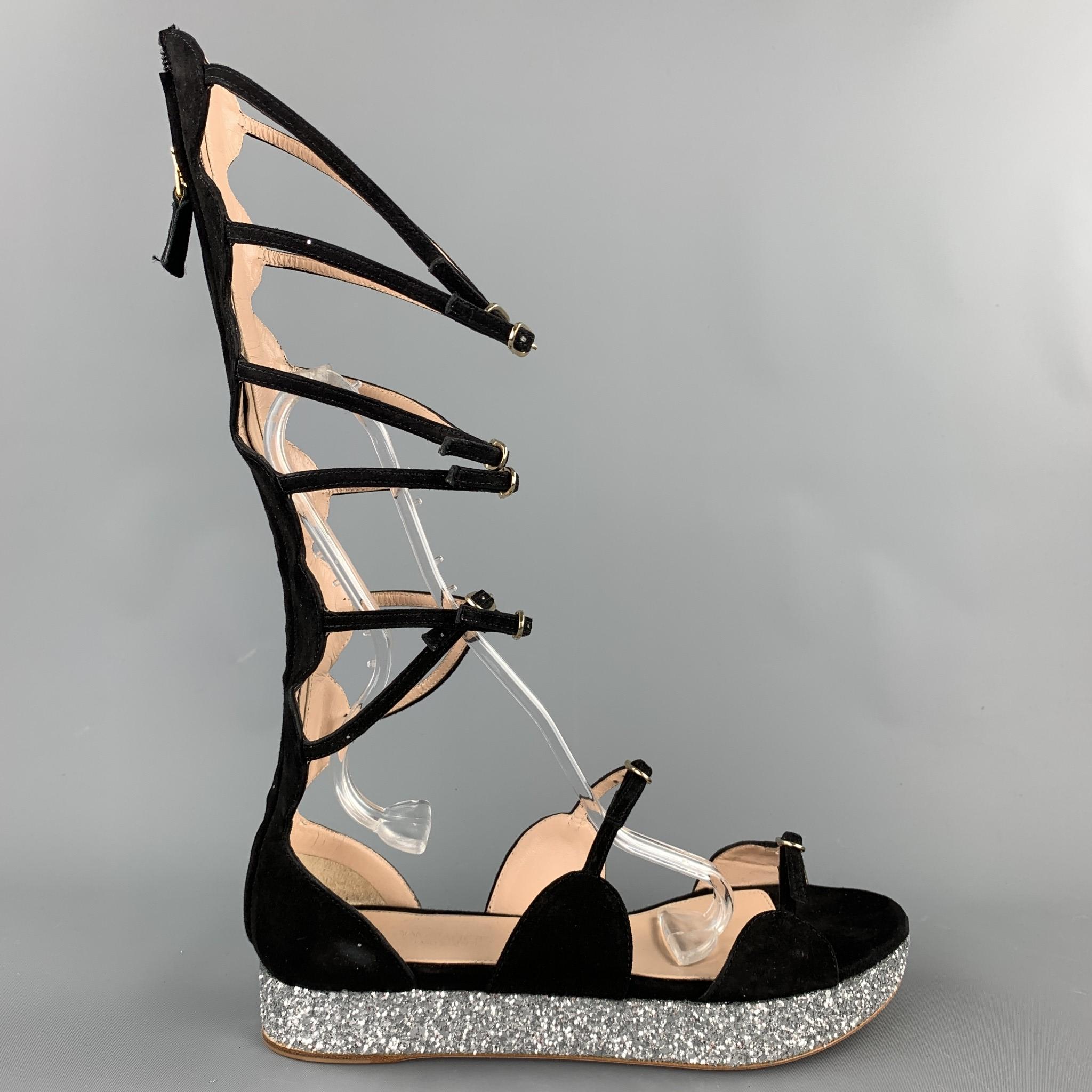GIAMBATTISTA VALLI sandals comes in a black suede with a glitter platform detail featuring a gladiator style and a back zip up closure. Comes with box. Made in Italy.

Very Good Pre-Owned Condition.
Marked: IT 38
Original Retail Price: