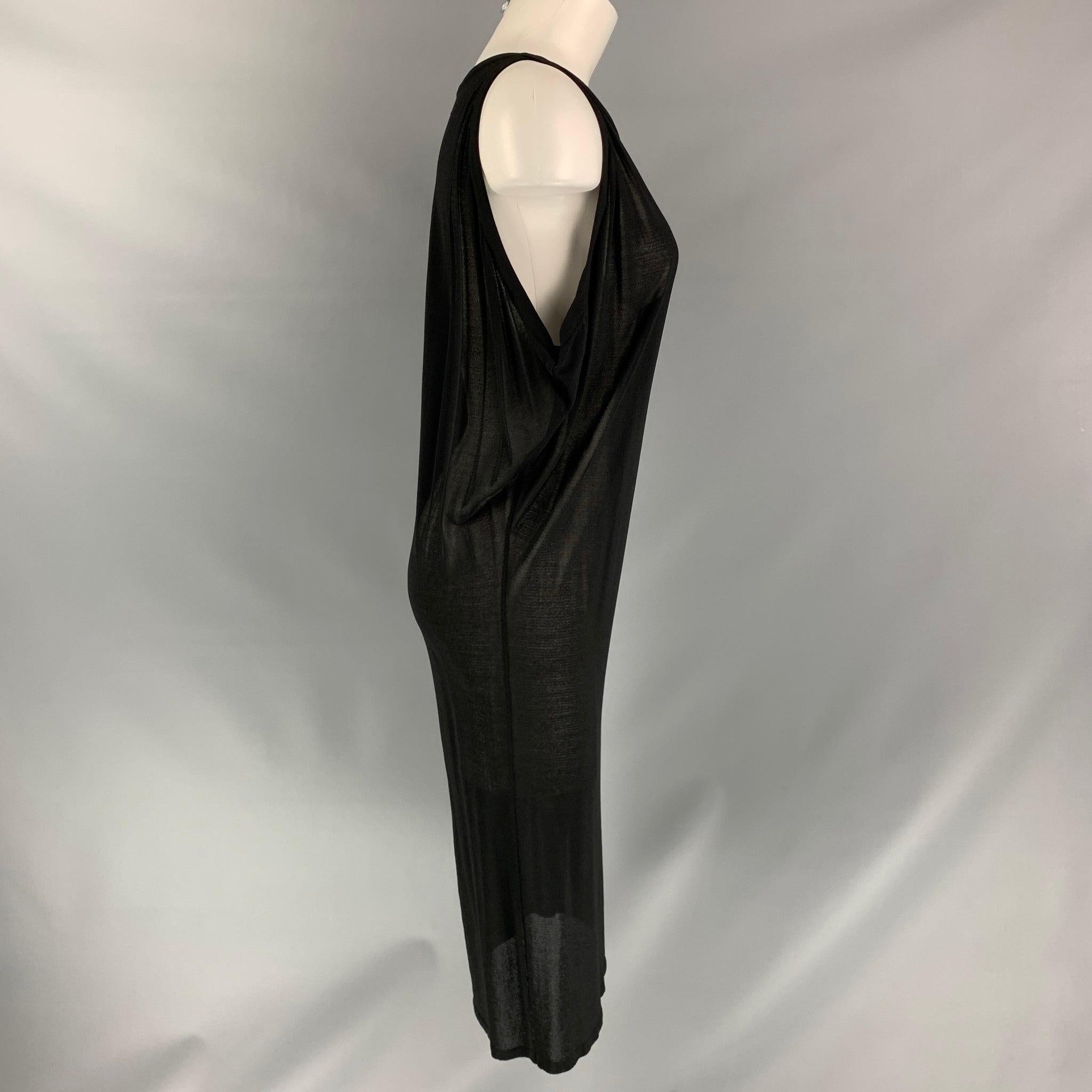 GIAMBATTISTA VALLI
 below knee dress comes in black viscose blend featuring a see through aesthetic. Made in Italy.
Excellent Good Pre-Owned Condition.  

Marked:   42 

Measurements: 
 
Shoulder: 11.5 inBust: 30 inWaist: 36 inHip: 40 in Length: 42