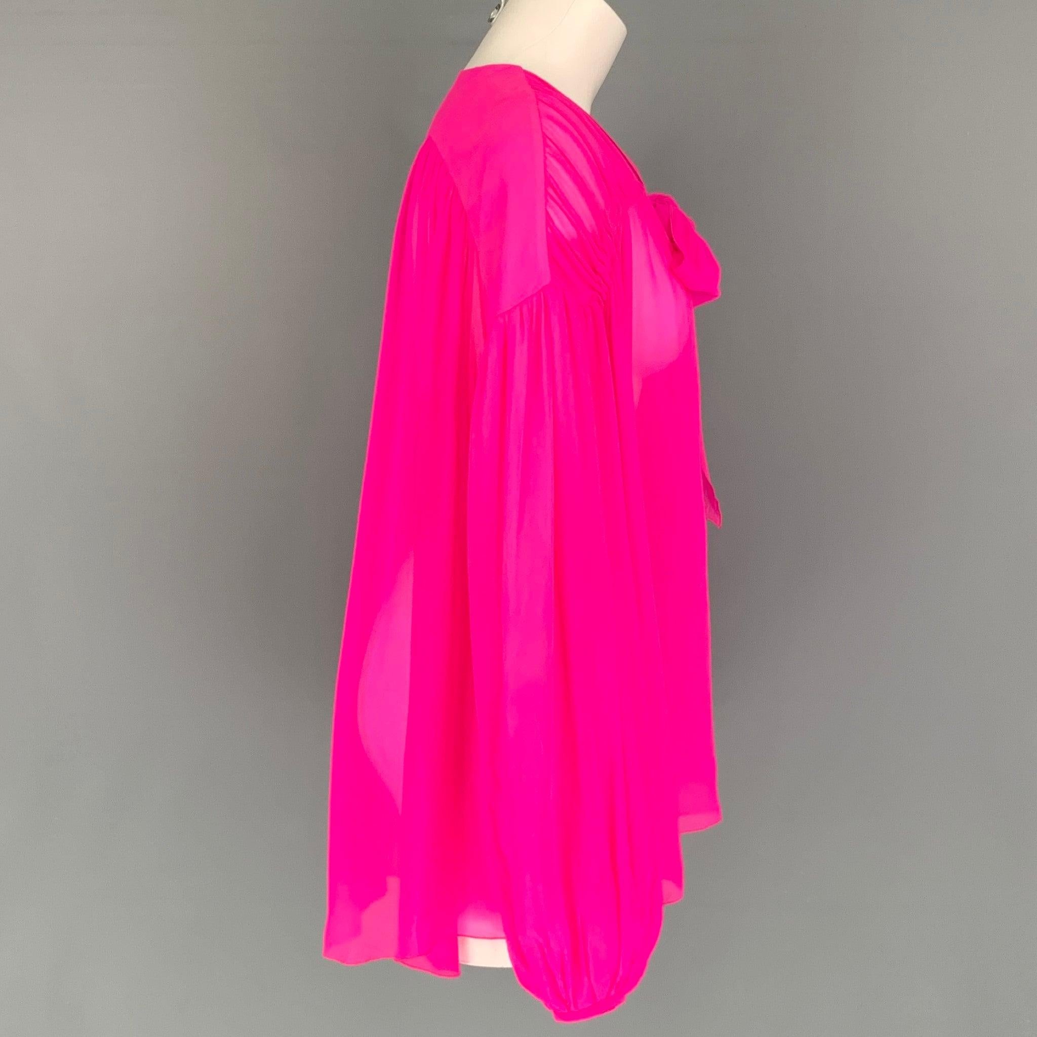 GIAMBATTISTA VALLI long sleeve tunic comes in a pink silk fabric featuring a see through style, ballon sleeves and neckline tie. Made in Italy.Very Good Pre-Owned Condition. Minor Marks at Back. 

Marked:   Not Marked. 

Measurements: 
 
Shoulder: