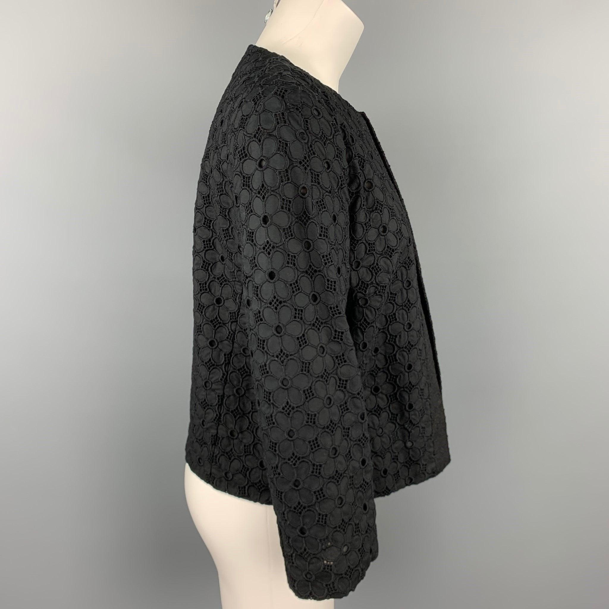 GIAMBATTISTA VALLI jacket comes in a black eyelet cotton with a full silk liner featuring a open front. Made in Italy.Very Good
Pre-Owned Condition. 

Marked:   No size marked 

Measurements: 
 
Shoulder: 15.5 inches 
Bust: 38 inches 
Sleeve: 21