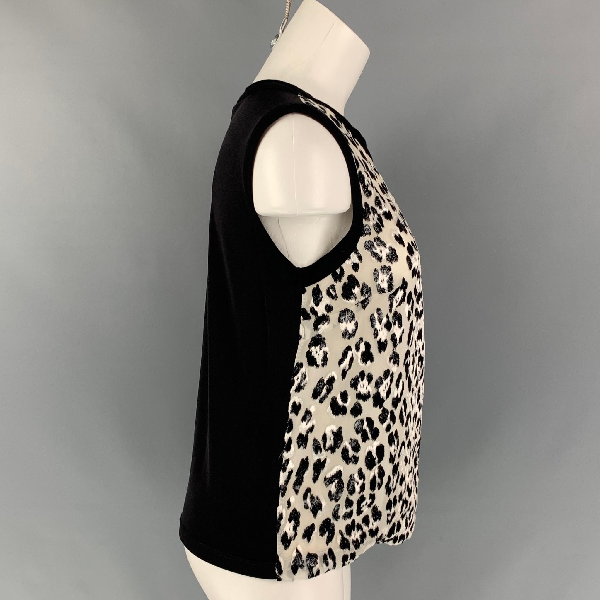 GIAMBATTISTA VALLI dress top comes in a black & white animal print silk featuring a sleeveless style, ribbed hem, and a crew-neck. Made in Italy. 

Very Good Pre-Owned Condition.
Marked: 44/M

Measurements:

Shoulder: 16 in.
Bust: 36 in.
Length: