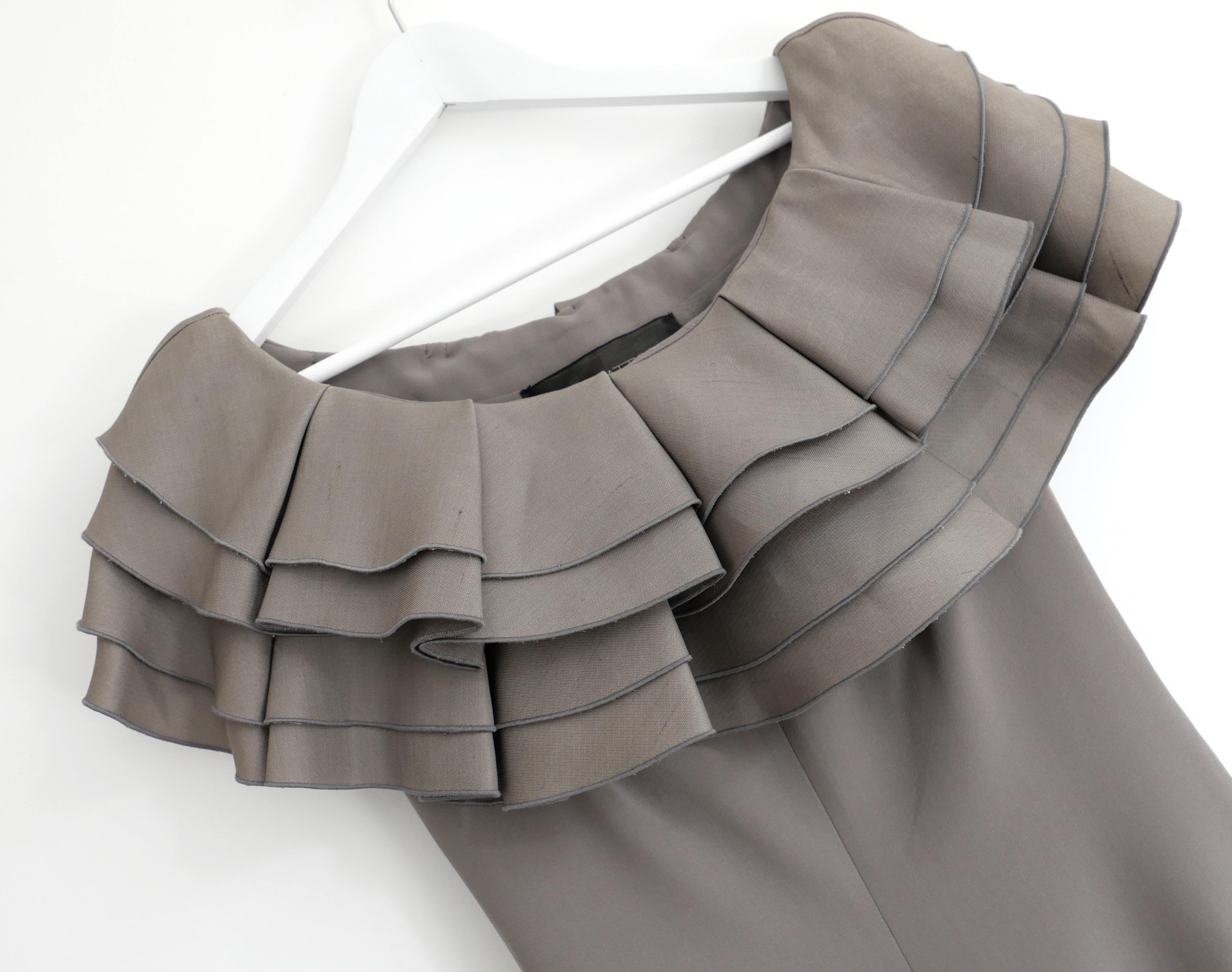 Sleek feminine Giambattista Valli taupe ruffle shoulder shift dress. Bought for £2500 and new with tags. Made from smooth silk and wool (70:30) crepe with a full lining. Beautifully tailored with a sexy and flattering form fitting cut topped with