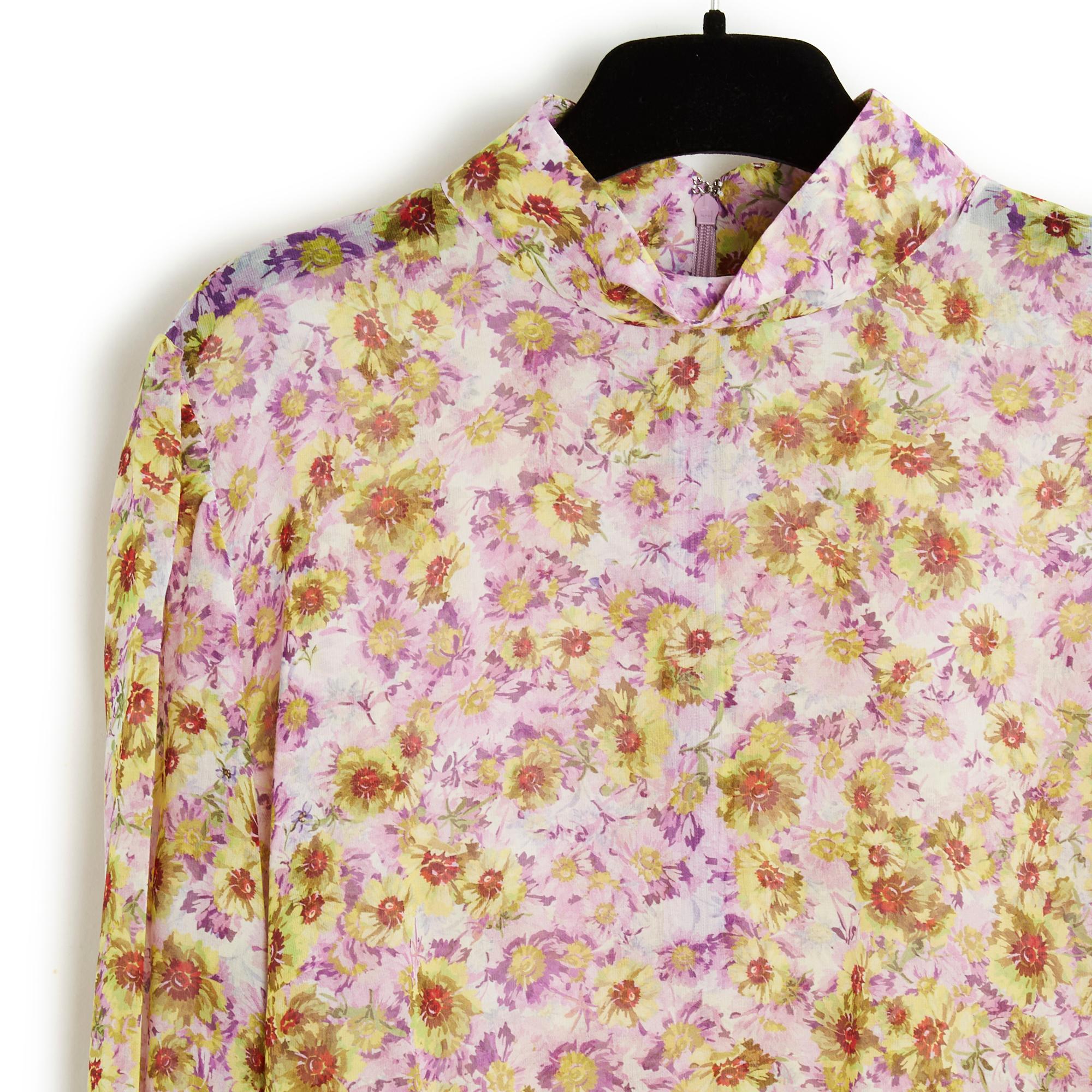 Top Giambattista Valli blouse in slightly transparent silk crepe with floral print in shades of pink, purple and yellow green, straight cut, high collar closed with a long zip and hook in the back, very long puffed sleeves at the wrist, closed with