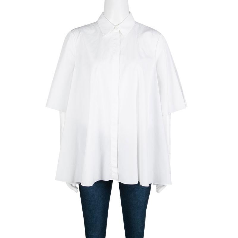 Channel a modern retro vibe with this cotton shirt from Giambattista Valli. In an understated white hue, movement-happy sleeves, and flowy silhouette, this shirt works well for work with contrasting pants and pumps.

Includes: The Luxury Closet