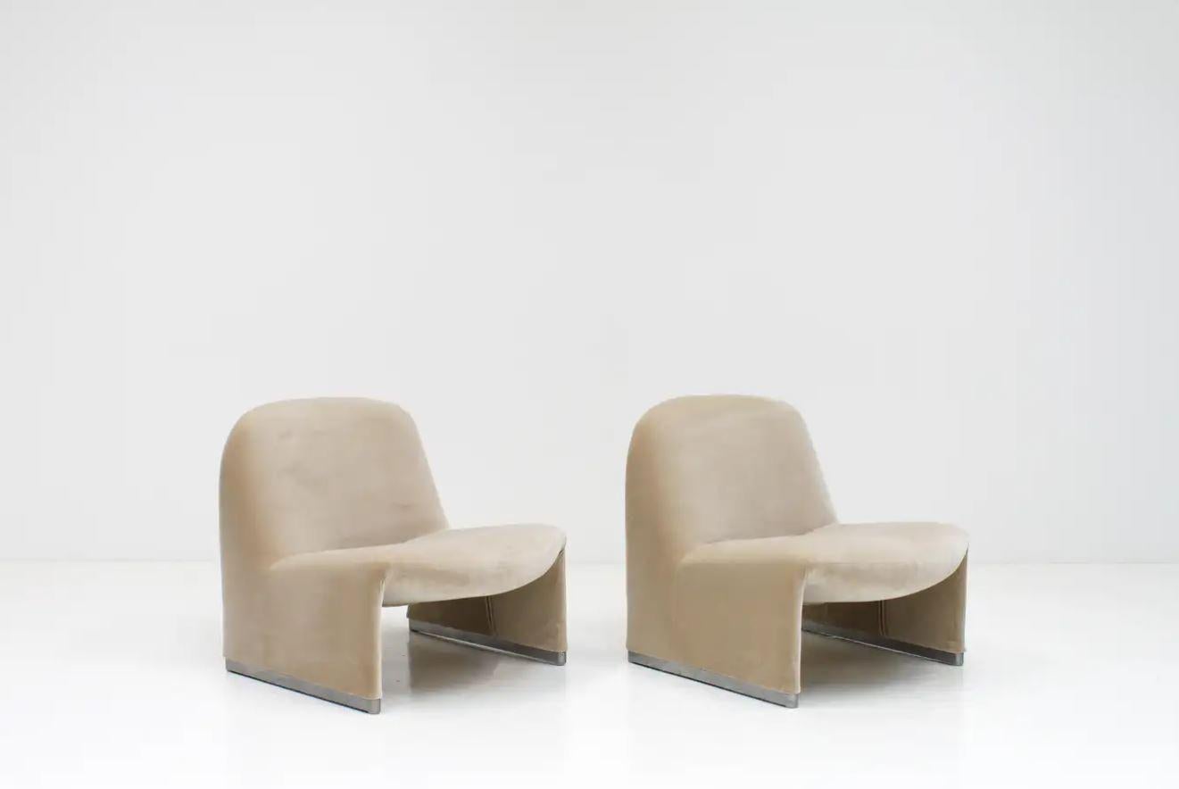 A pair of Giancarlo Piretti “Alky” chairs newly upholstered in Designers Guild linen-colored cotton velvet.

Designers Guild 'Varese' velvet, is a cotton velvet that is lustrous and elegant.

The Alky chairs themselves were manufactured by Artifort
