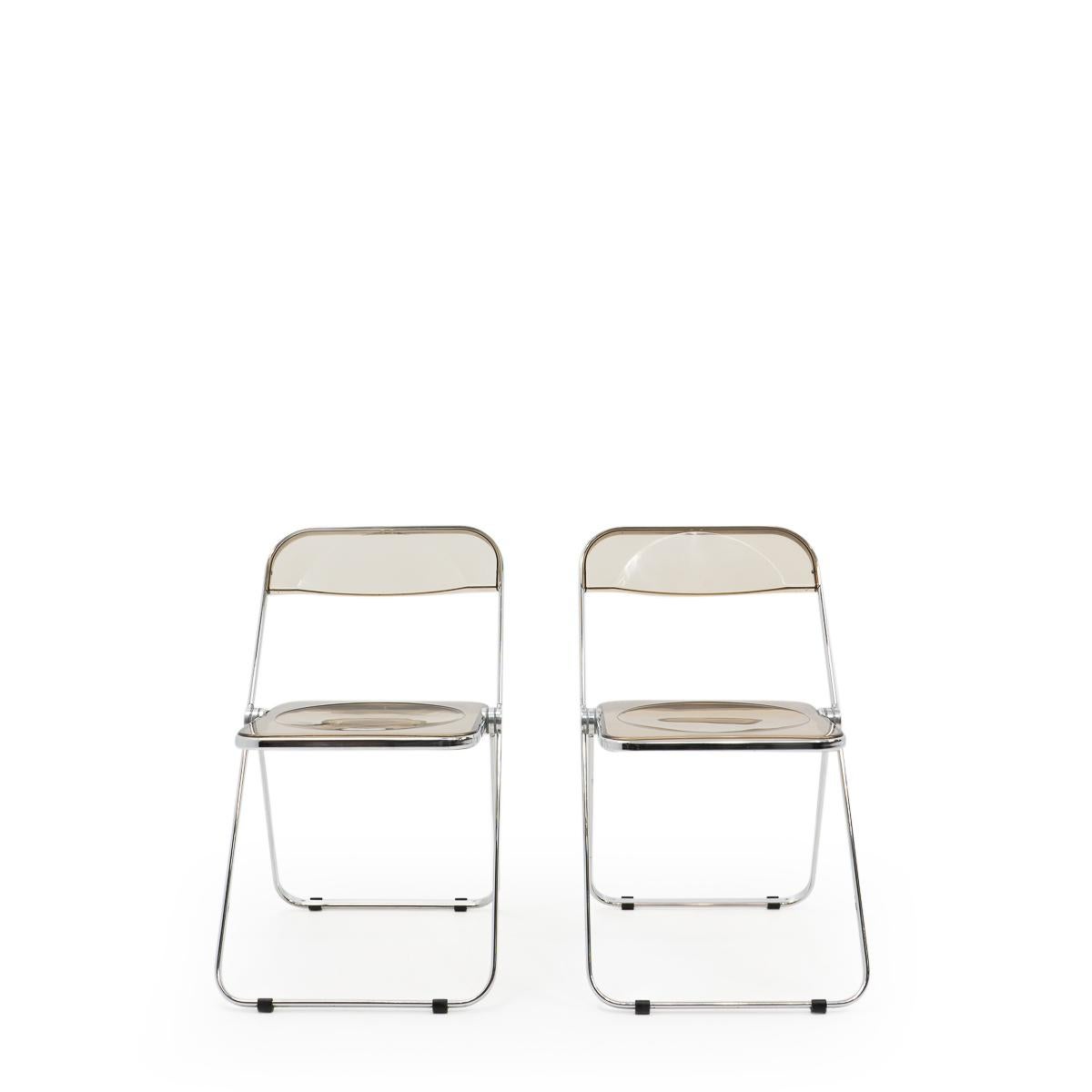 Plia foldable chairs produced by Castelli and designed by Giancarlo Piretti (also known for the Alky or Plona lounge chairs).

These iconic folding chairs are still in very good condition, and very practical in their use: They can be easily stored