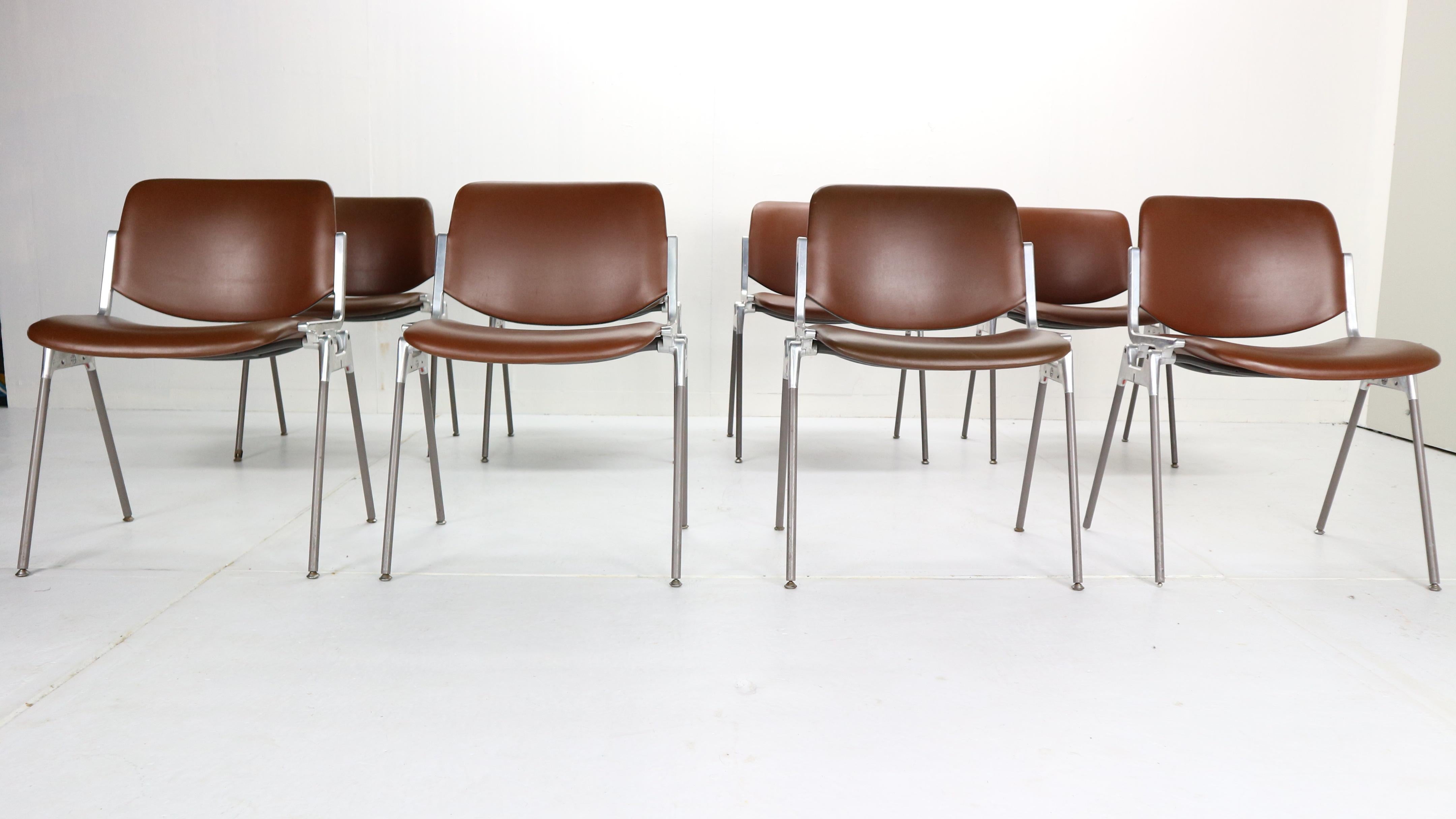Set of 8 dining or desk chairs designed by Giancarlo Piretti and manufactured for Castelli & Anonima Castelli, 1960s, Italy.
Model- DSC 106, originally marked.
Chairs are made of aluminum steel frames. The seat is covered in brown faux leather and