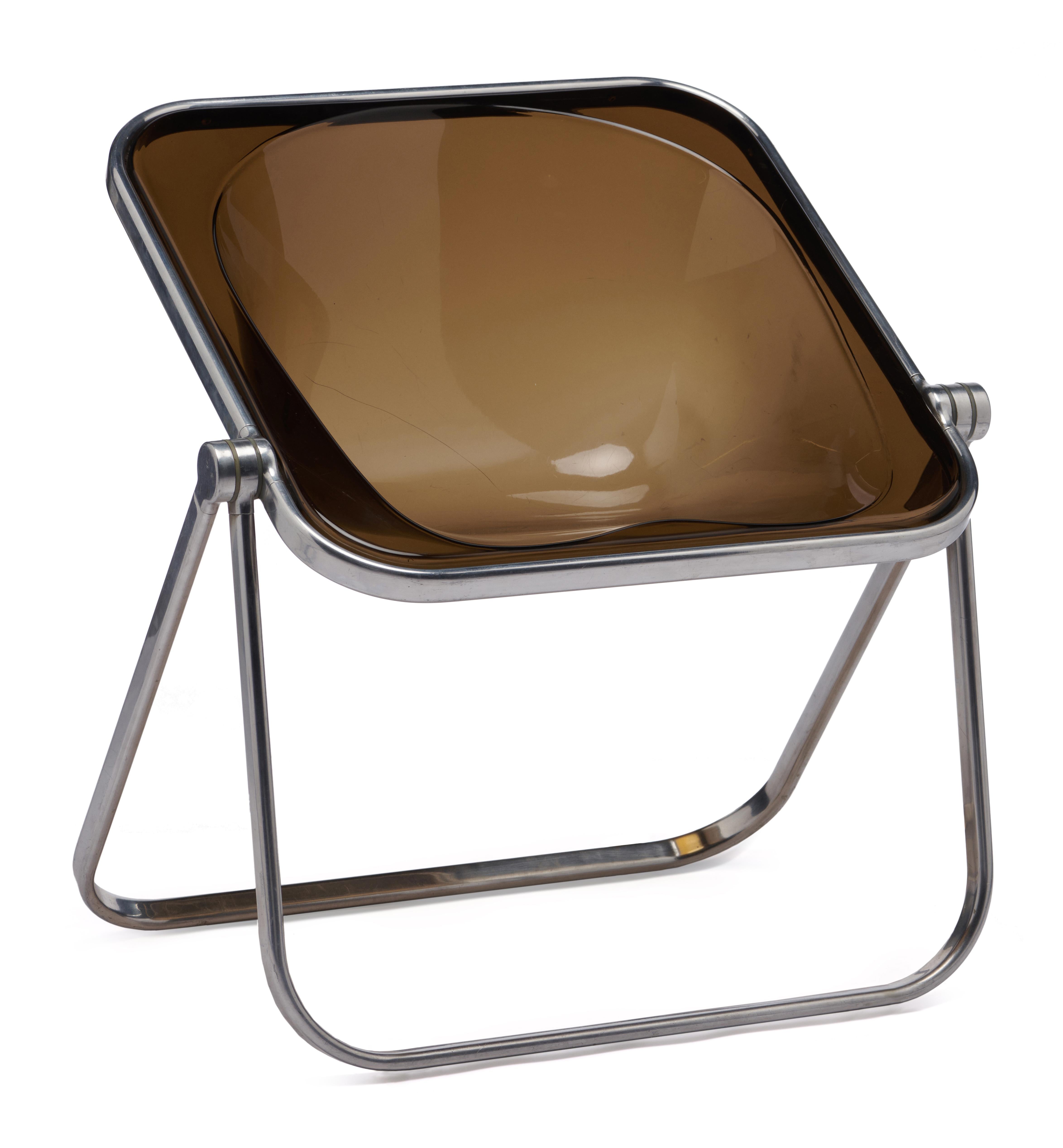 Designed in 1970 by Giancarlo Piretti, Plona is a folding and stackable armchair. The solid tubular structure is in polished stainless aluminum alloy, with hinges in die-cast light alloy. 

Good vintage condition. Some scratches and scuffs