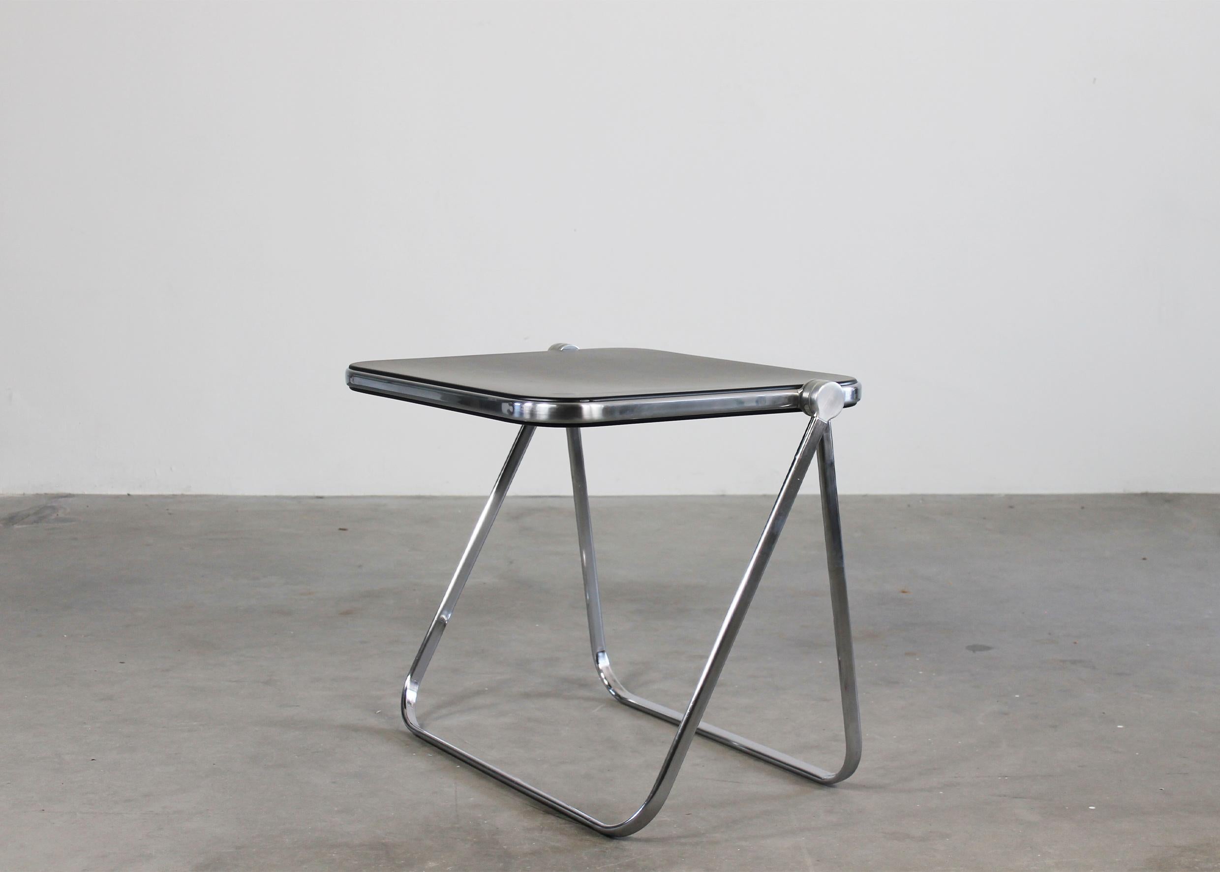 Platone folding table or desk with structure in chromed steel and die-cast aluminum, table top in black ABS.
Designed by Giancarlo Piretti and produced by Anonima Castelli in 1970s, Italy. 
Platone table is part of the permanent design collection of