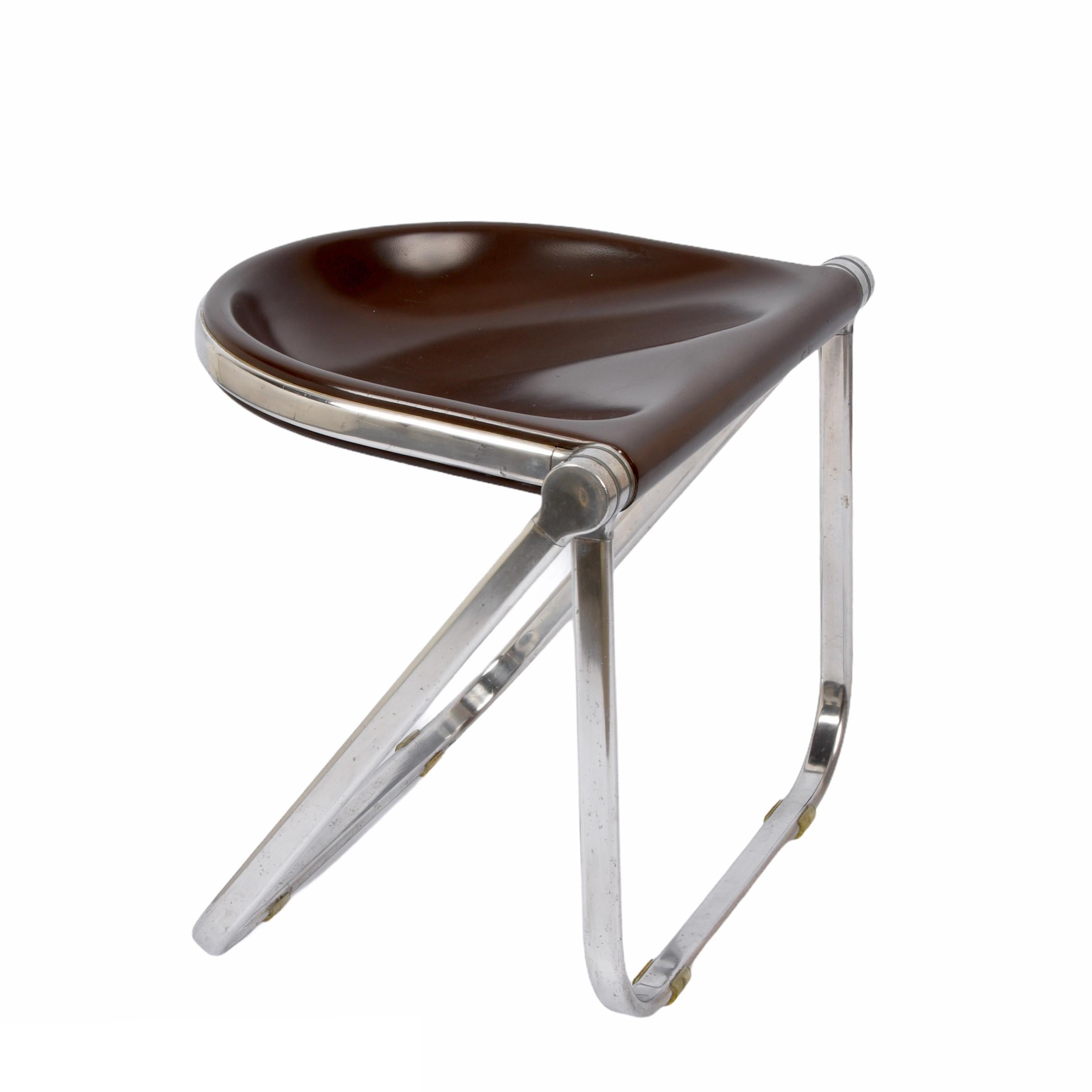 Incredible folding stool in chromed aluminium laminate and brown hard plastic. This super rare model, called 