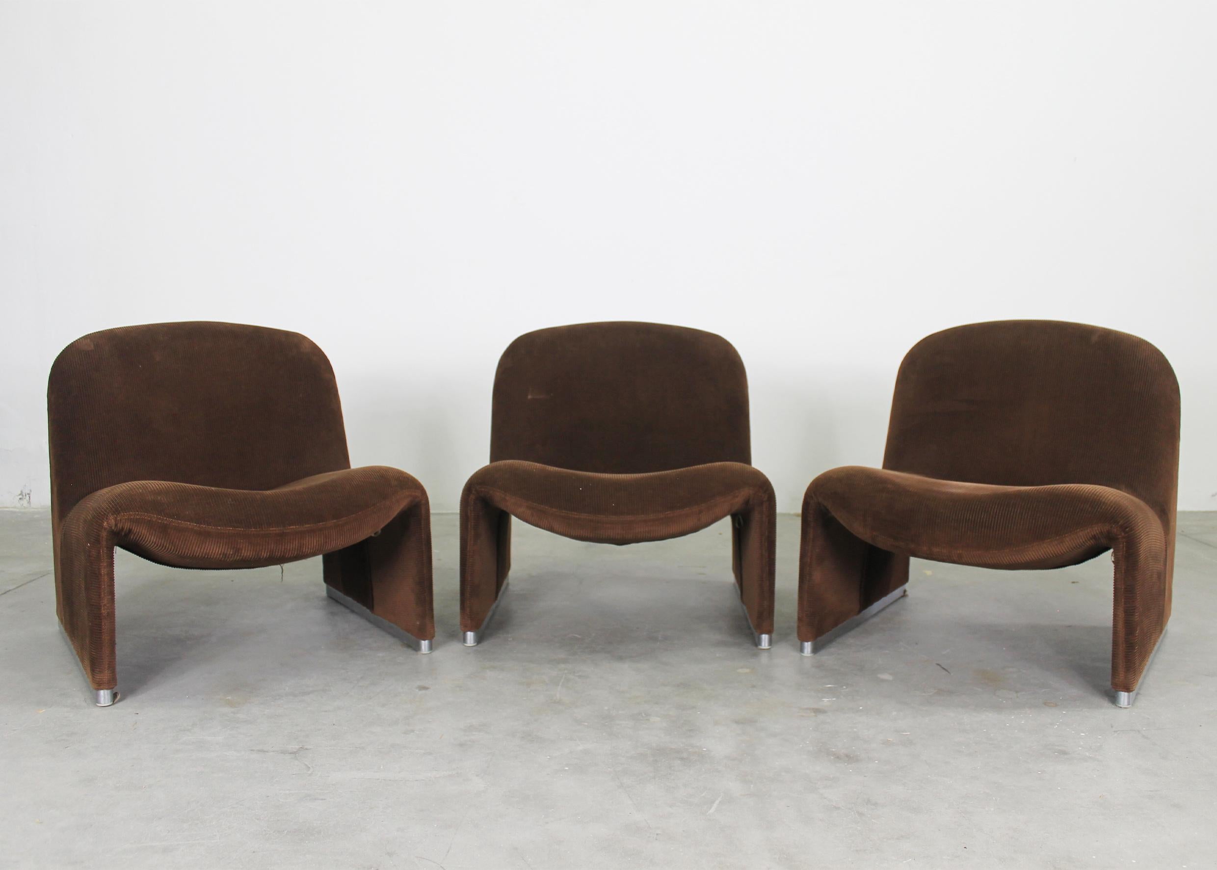 Set of three Alky chairs with a structure in aluminum covered with dark brown velvet and chromed metal feet.
Designed by Giancarlo Piretti in the 1970s for Anonima Castelli. 
The manufacturer's label is present under the seat.

The Alky chair was