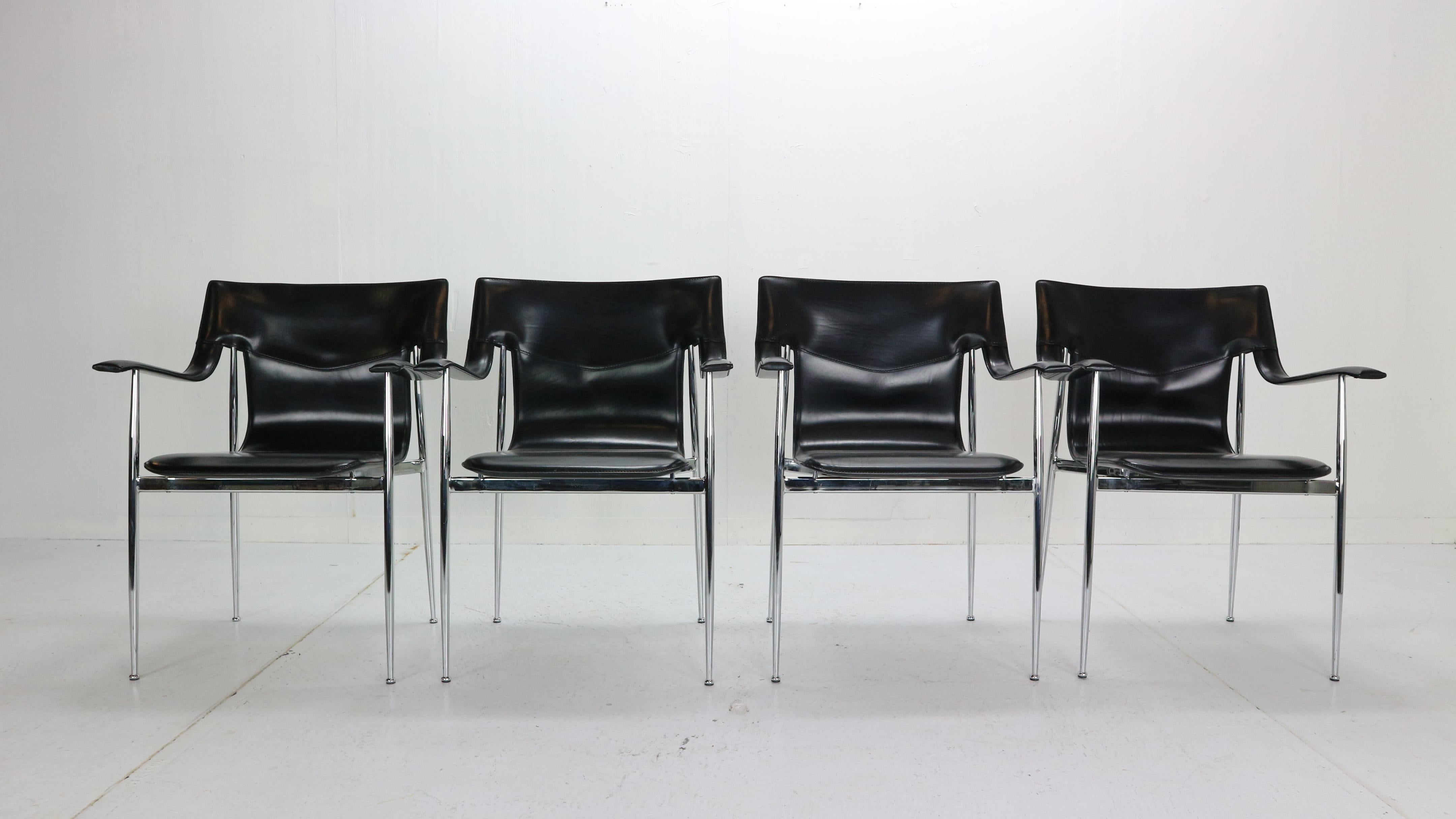 Set of four original dining room chairs by Giancarlo Vegni & Gianfranco Gualtierotti for Fasem. Italian design of the 1980s.
Item features black stitched saddle leather seat and armrests, tapered chrome frame and elegant thin legs, original stamp