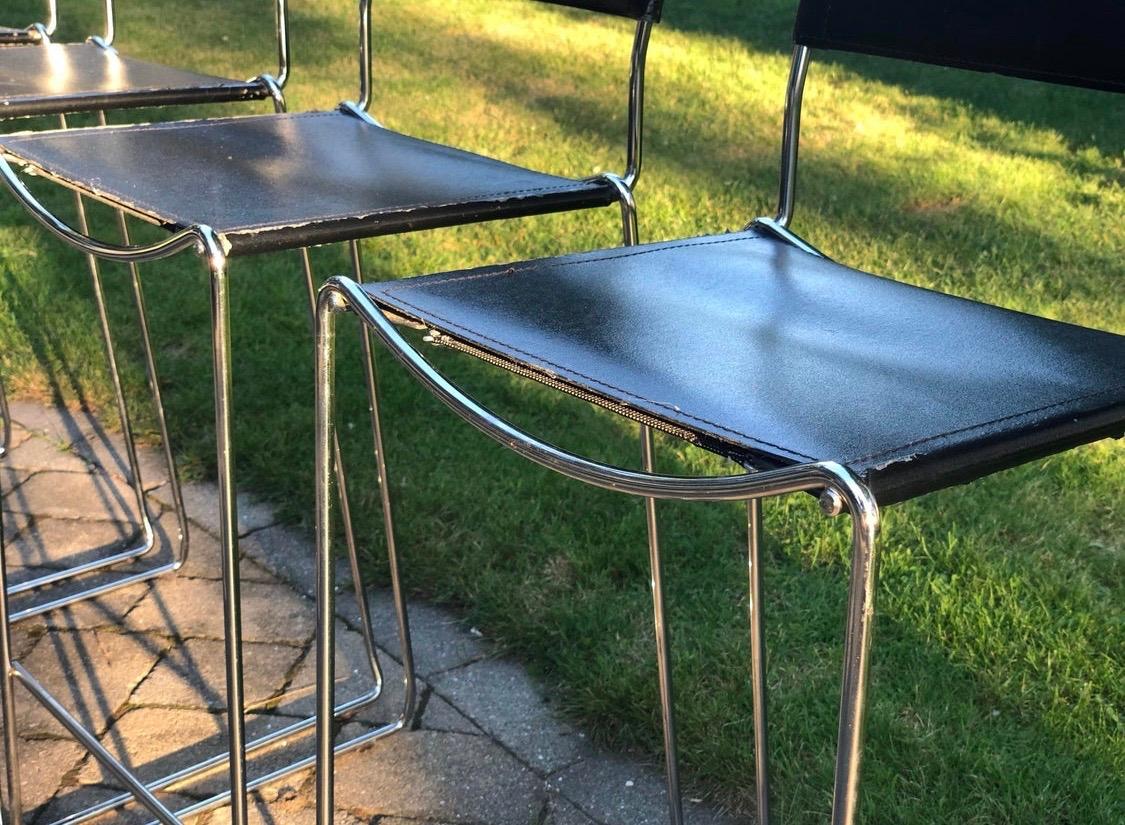 Belotti for Alias, 1980s set of four bar stools in good vintage condition with wear at the supports. The chrome and spring system both look good. Great minimalist design, lines and scale. They are sturdy and stackable with a seat height of 27.75