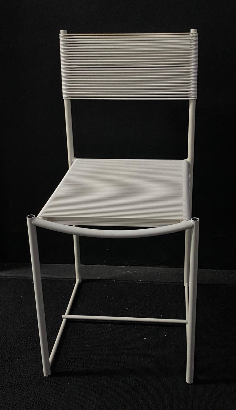Spaghetti chair with white cording attached to a white lacquered frame designed by Giandomenico Belotti and manufactured by Alias. Italy 1980s. 

A symbol in the history of design, the Spaghetti chair is the first Alias chair to appear in the MoMA