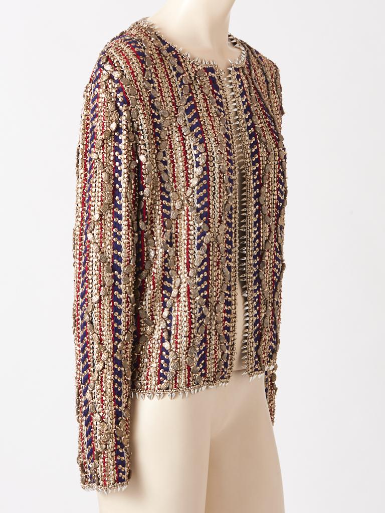 Gianfranco Ferre, evening jacket/cardigan heavily encrusted with beads and embroidery. Composed of silver metallic beading, vertically placed, embellished with large metallic scarab themed beads combined with red and navy vertical embroidery on a