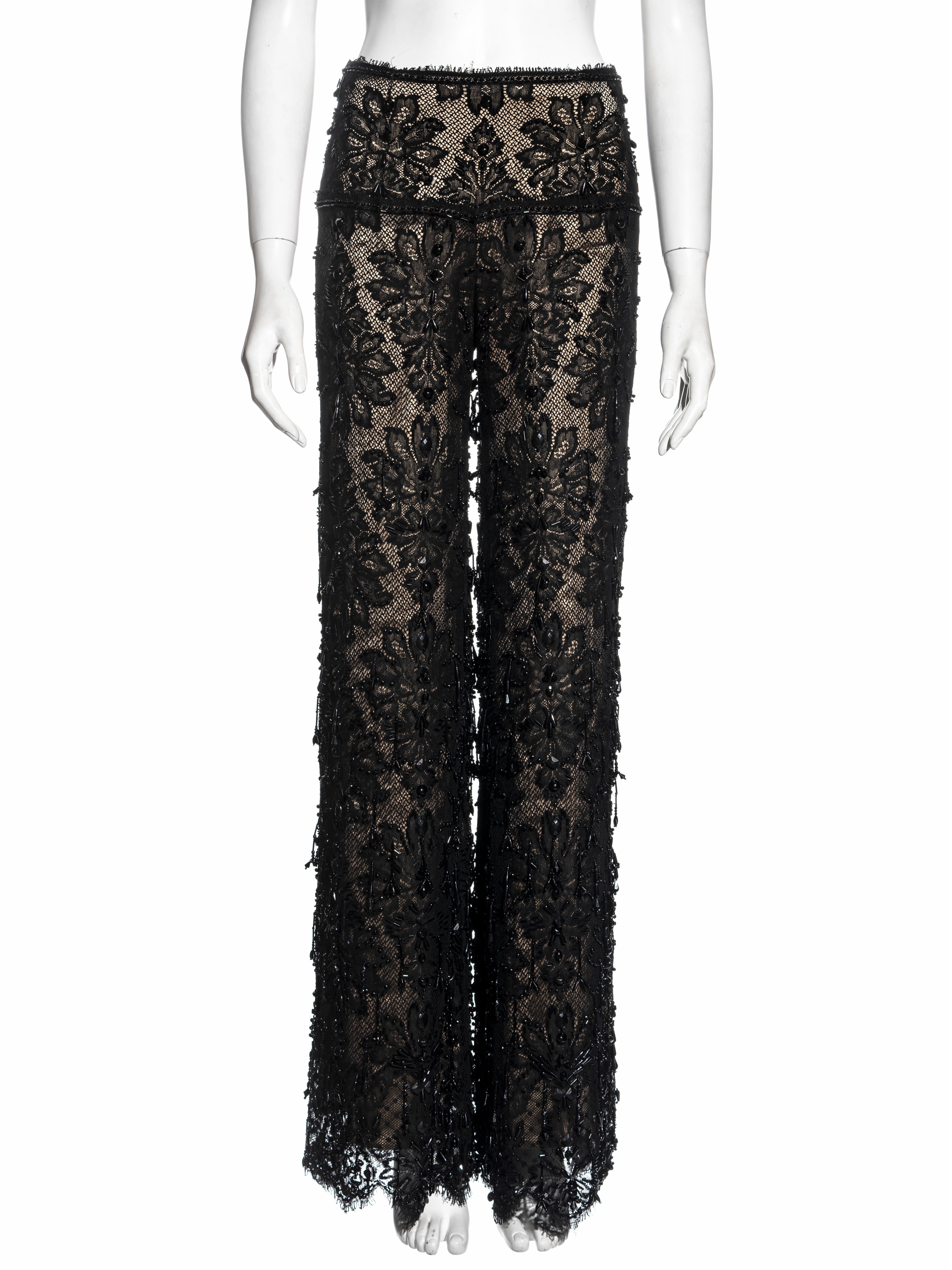 ▪ Gianfranco Ferré black lace evening pants
▪ French lace
▪ Black beading throughout  
▪ Wide-leg 
▪ Nude silk lining 
▪ IT 42 - FR 38 - UK 10 - US 6
▪ Spring-Summer 2002
▪ Made in Italy