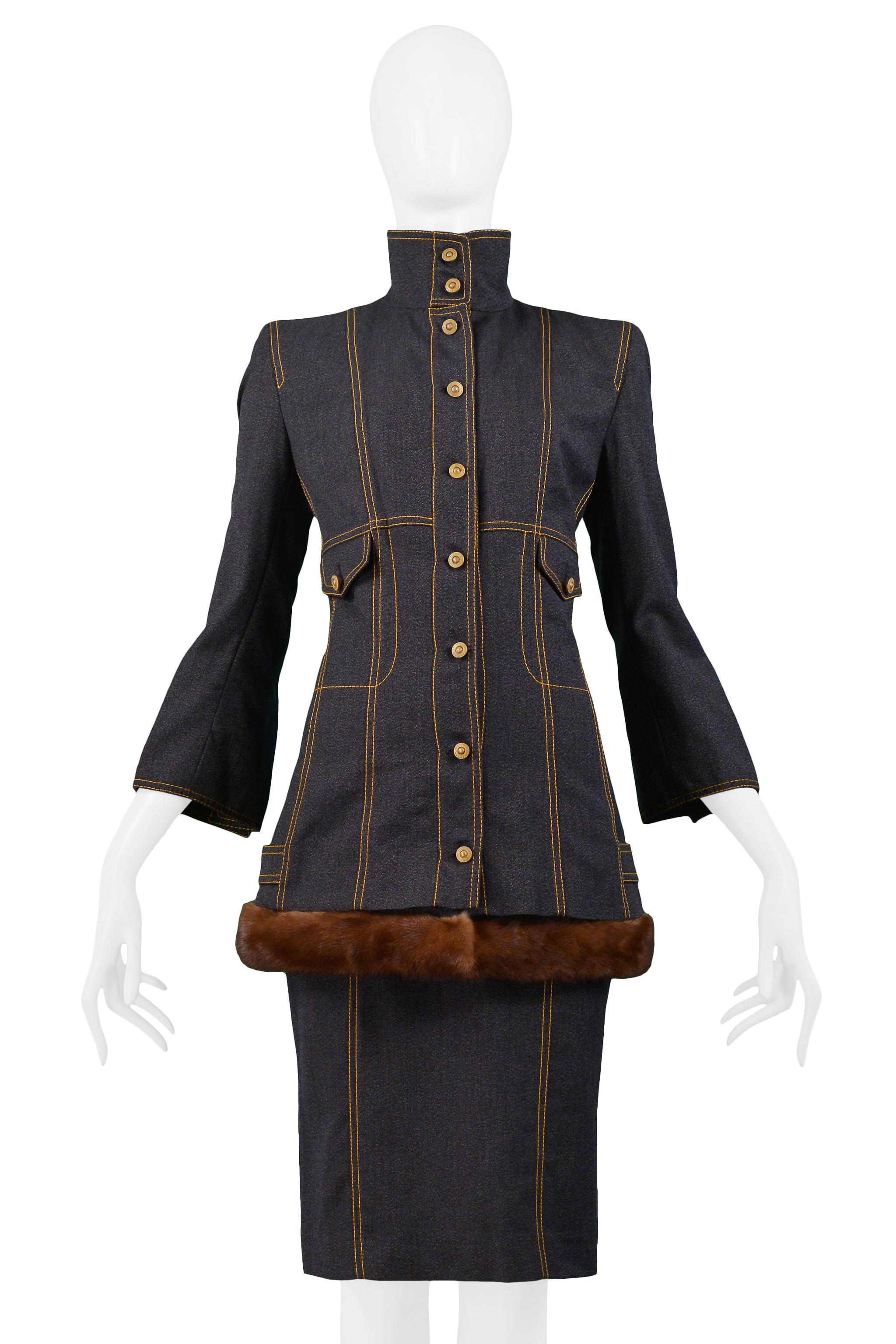 Resurrection is pleased to offer this vintage Gianfranco Ferre ultra-dark denim jacket and skirt ensemble. The hip-length jacket features stand up collar, yellow topstitching details throughout, flap pockets at waist, flared three-quarter length