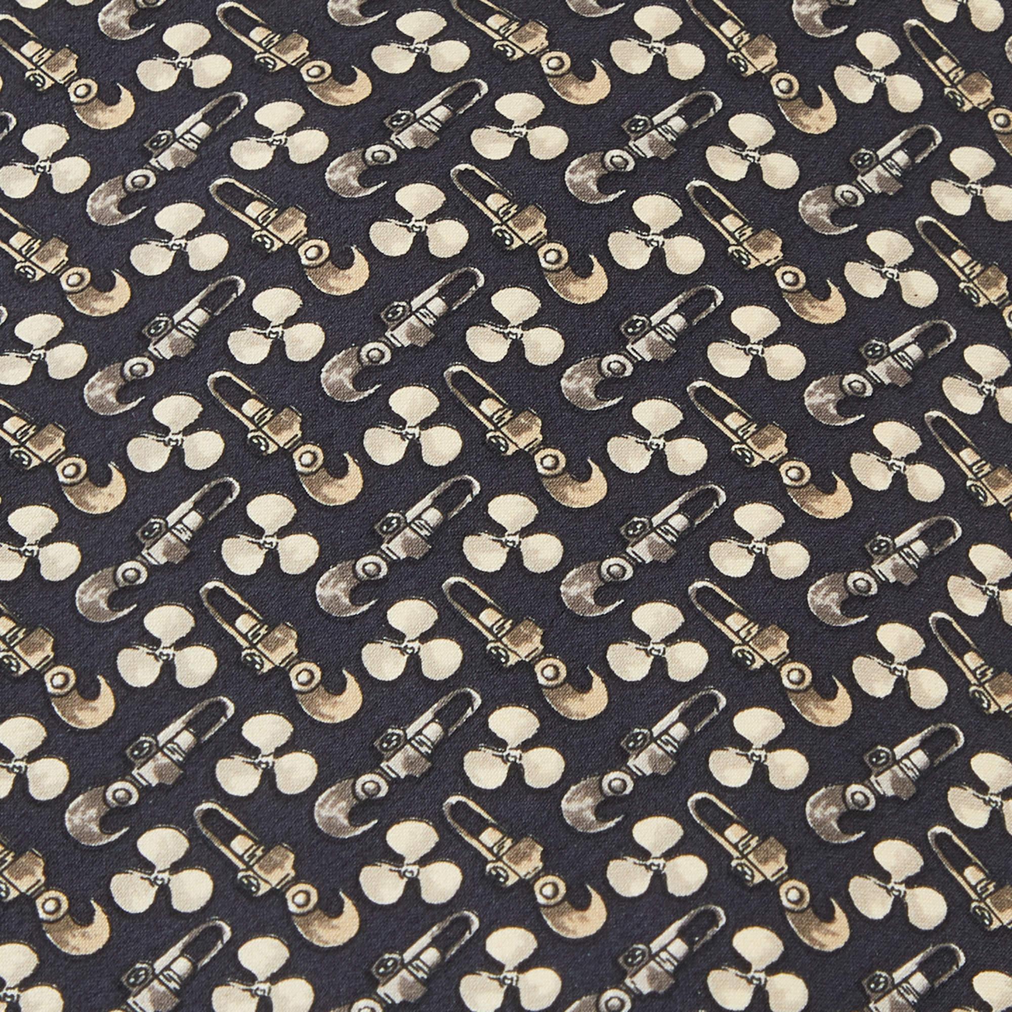 This tie is a perfect formal accessory that has a sharp and modern appeal. Made from luxurious materials  it features intricate patterns  and the brand label neatly stitched at the back. It is sure to add oodles of style to your blazers.