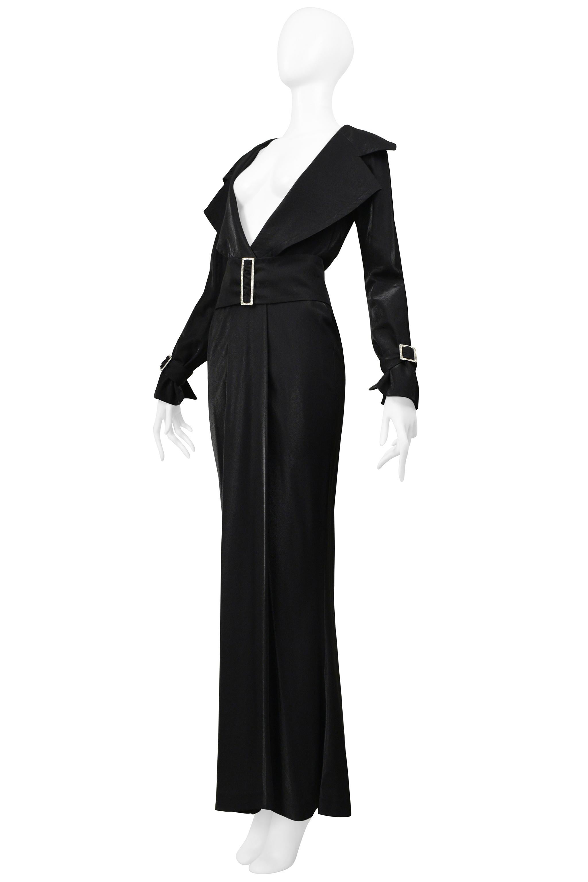 Resurrection Vintage is excited to offer a vintage Gianfranco Ferre black metallic trench coat dress featuring an exposed neckline, trench coat collar, rhinestone buckles at the cuffs and waist belt, wrap over skirt, and gown length. A non attached