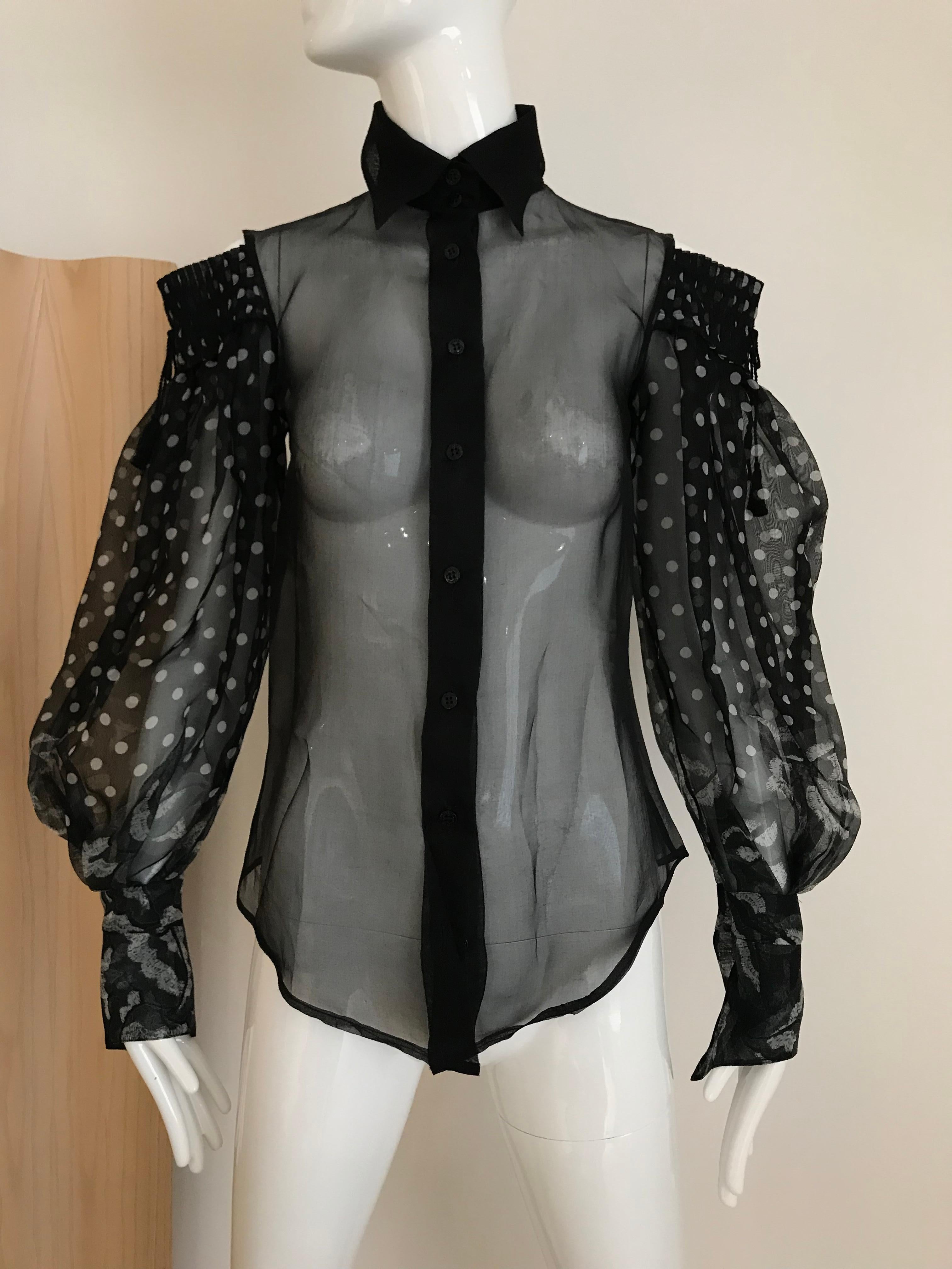 Gianfranco Ferre Sheer Black polkadot Silk blouse with dramatic sleeves
Size: small
Bust: 34 inches