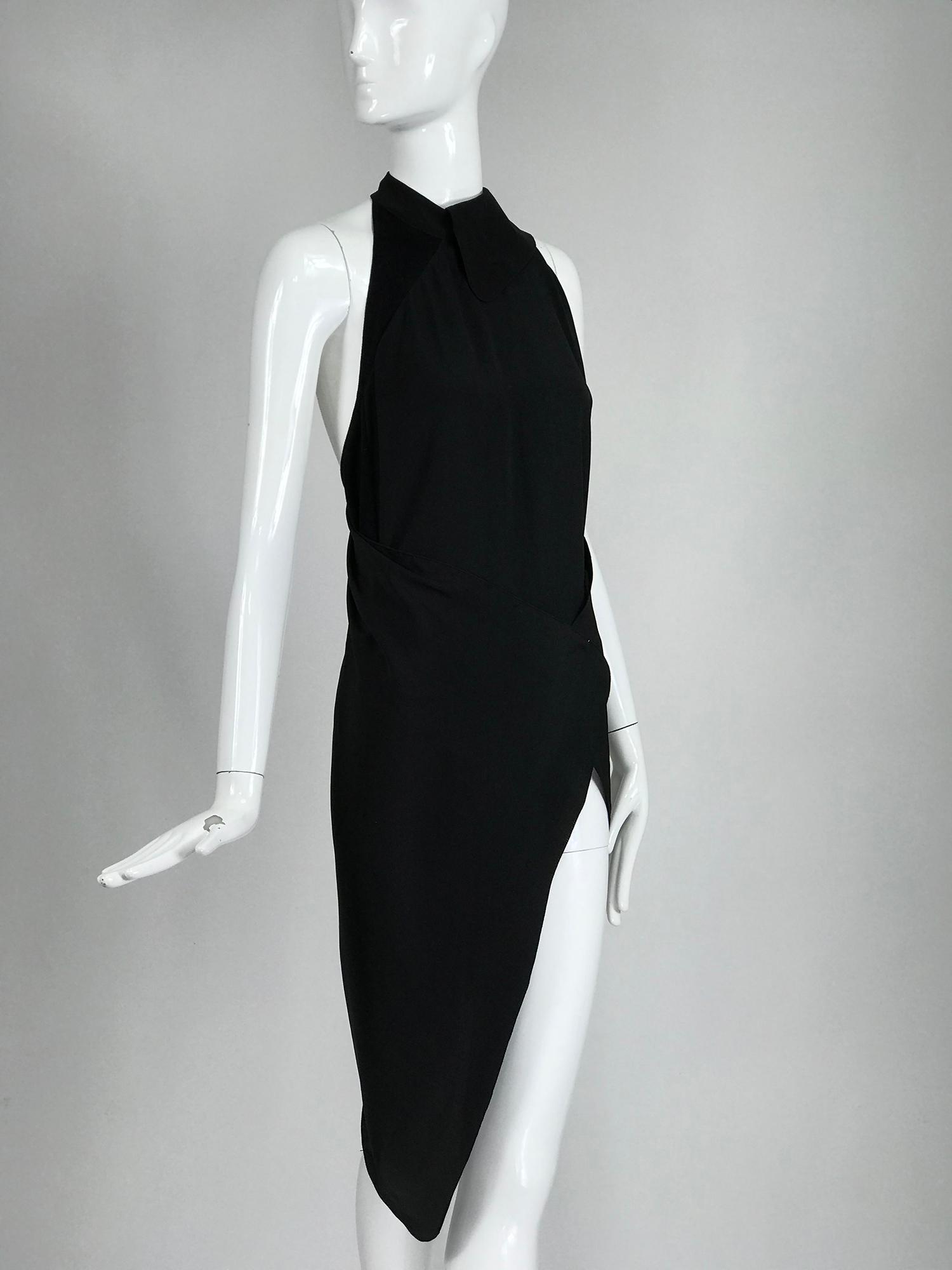 Gianfranco Ferre black silk and sweater knit body suit with wrap skirt or drape from the 1980s. This unique garment consists of a body suit that closes at the collar neckline with a hidden button, it is geometrically pieced with silk blend fabric