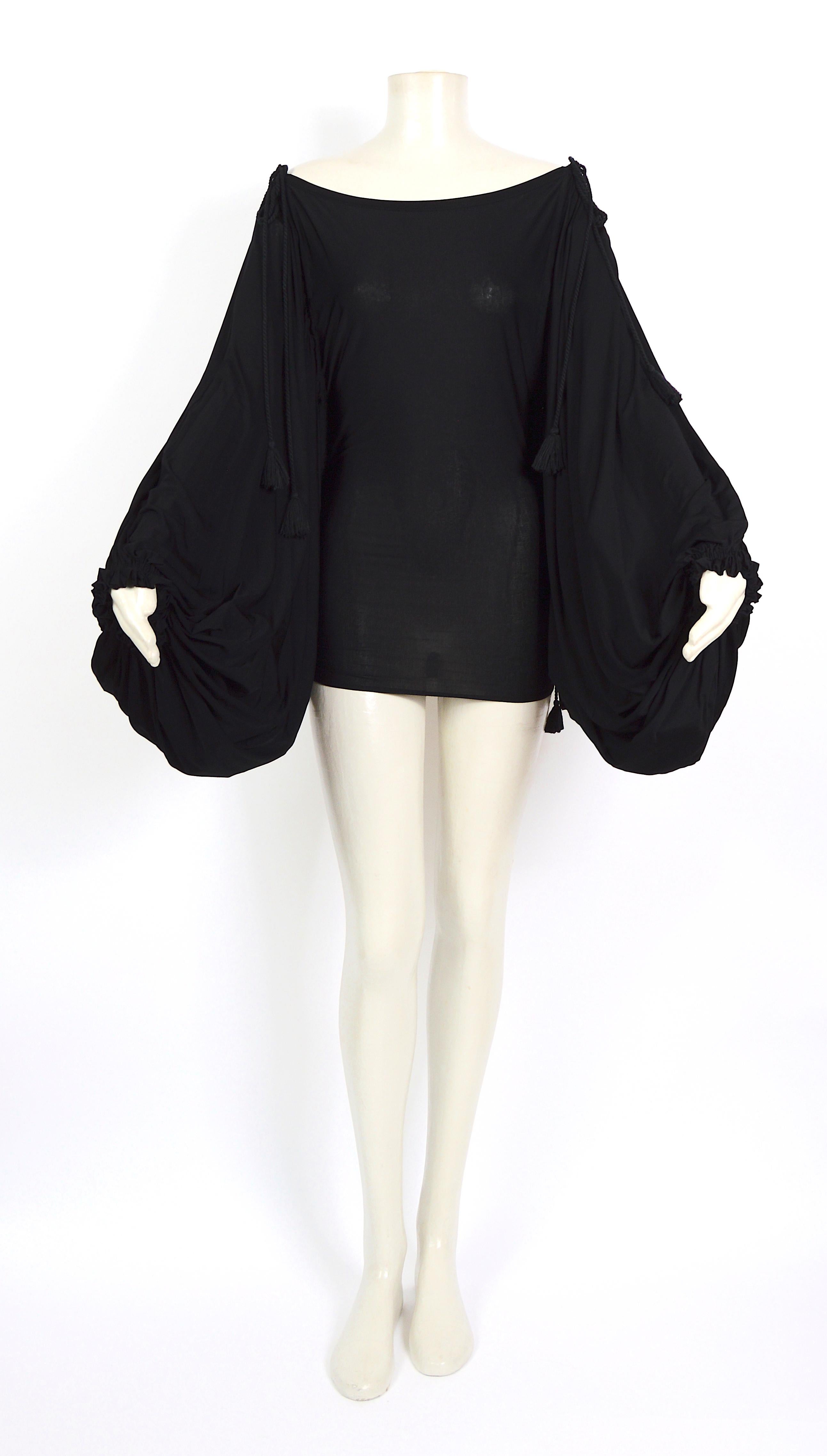 Fantastic piece by Gianfranco Ferré made in black silk jersey. The tasseled strings allow you to pull and drape this piece into a sexy mini dress or short top, both options are stunning!!!!.
Excellent condition
Italian size 42