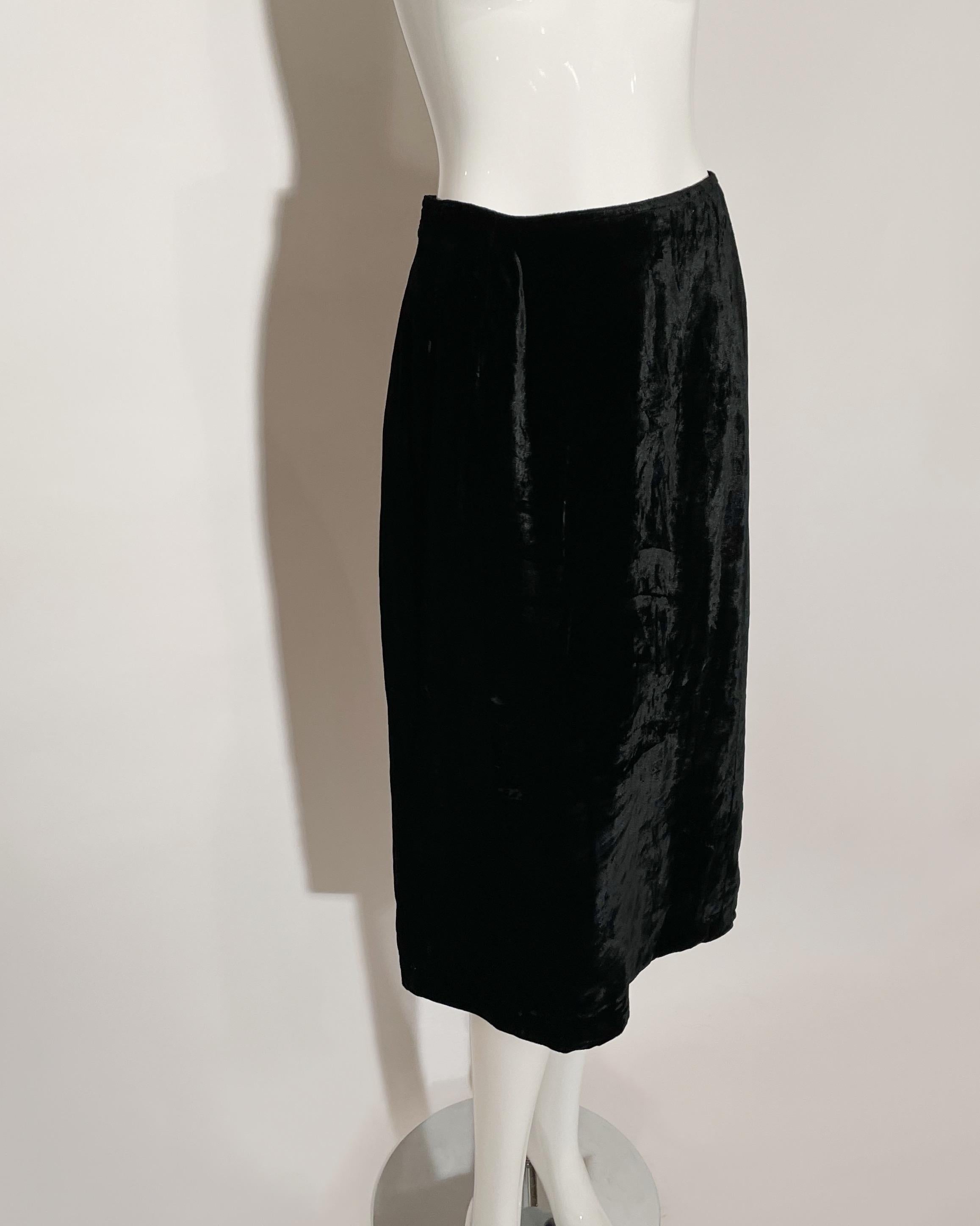Black velvet skirt. Over the knee. Lined. Rear button and zipper closure. Lined. Made in Italy. 
*Condition: Excellent vintage condition. No visible flaws.

Measurements Taken Laying Flat (inches)—
Waist:  30 in.
Hip: 38 in.
Length: 29 in.
Marked
