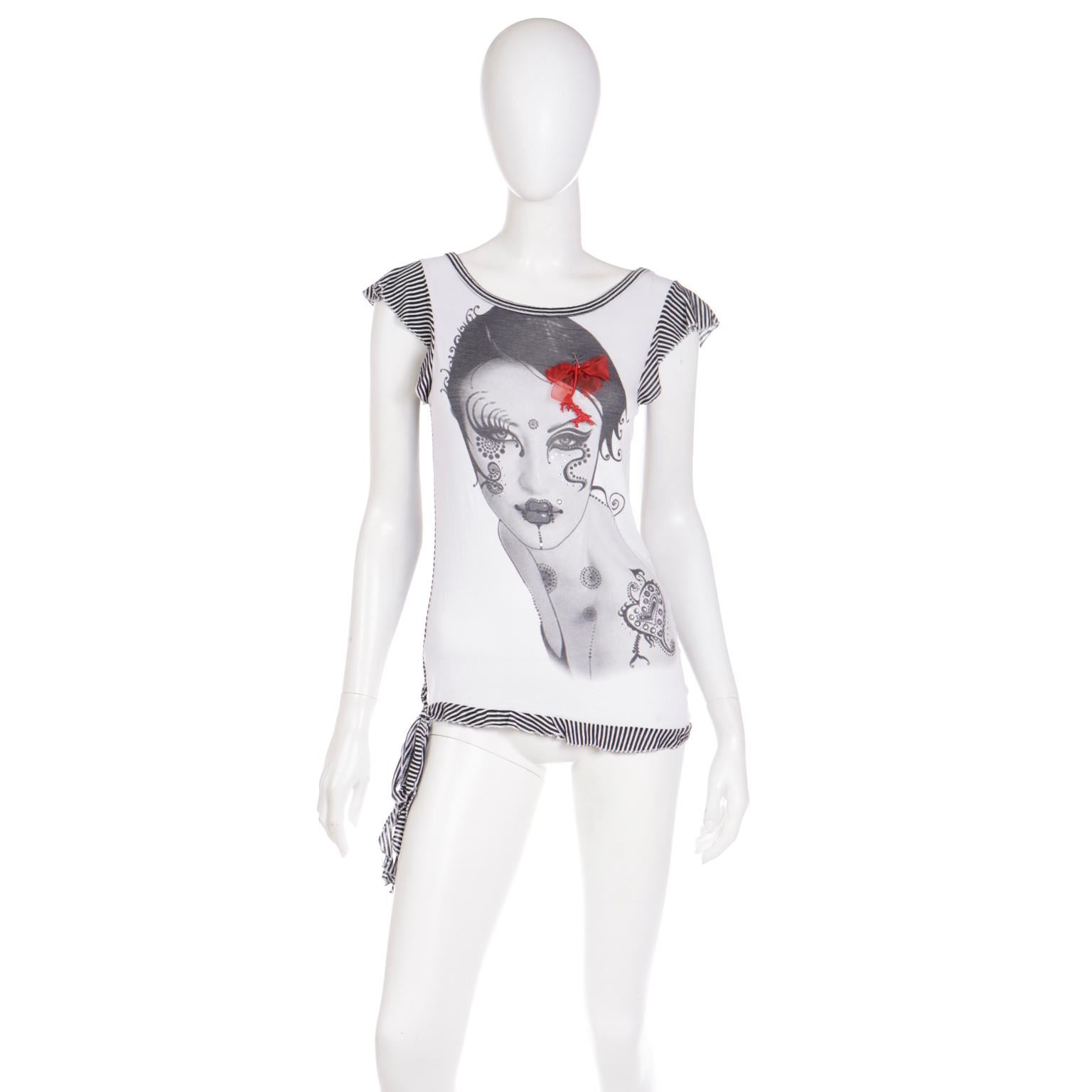 This is such an effortlessly fun vintage Gianfranco Ferre top featuring a woman in black and white on the front with a detachable red bow in her hair and pretty rhinestone embellishments on her face and her 