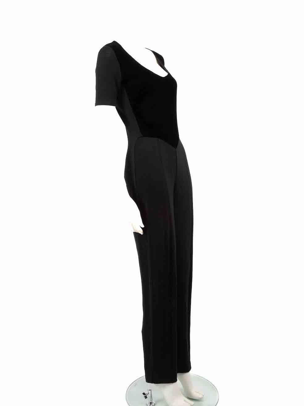 CONDITION is Very good. Minimal wear to jumpsuit is evident. There is a small pluck to the weave on the right side knee area on this used Gianfranco Ferré designer resale item.
 
 
 
 Details
 
 
 Black
 
 Wool
 
 Jumpsuit
 
 Short sleeves
 
 Back