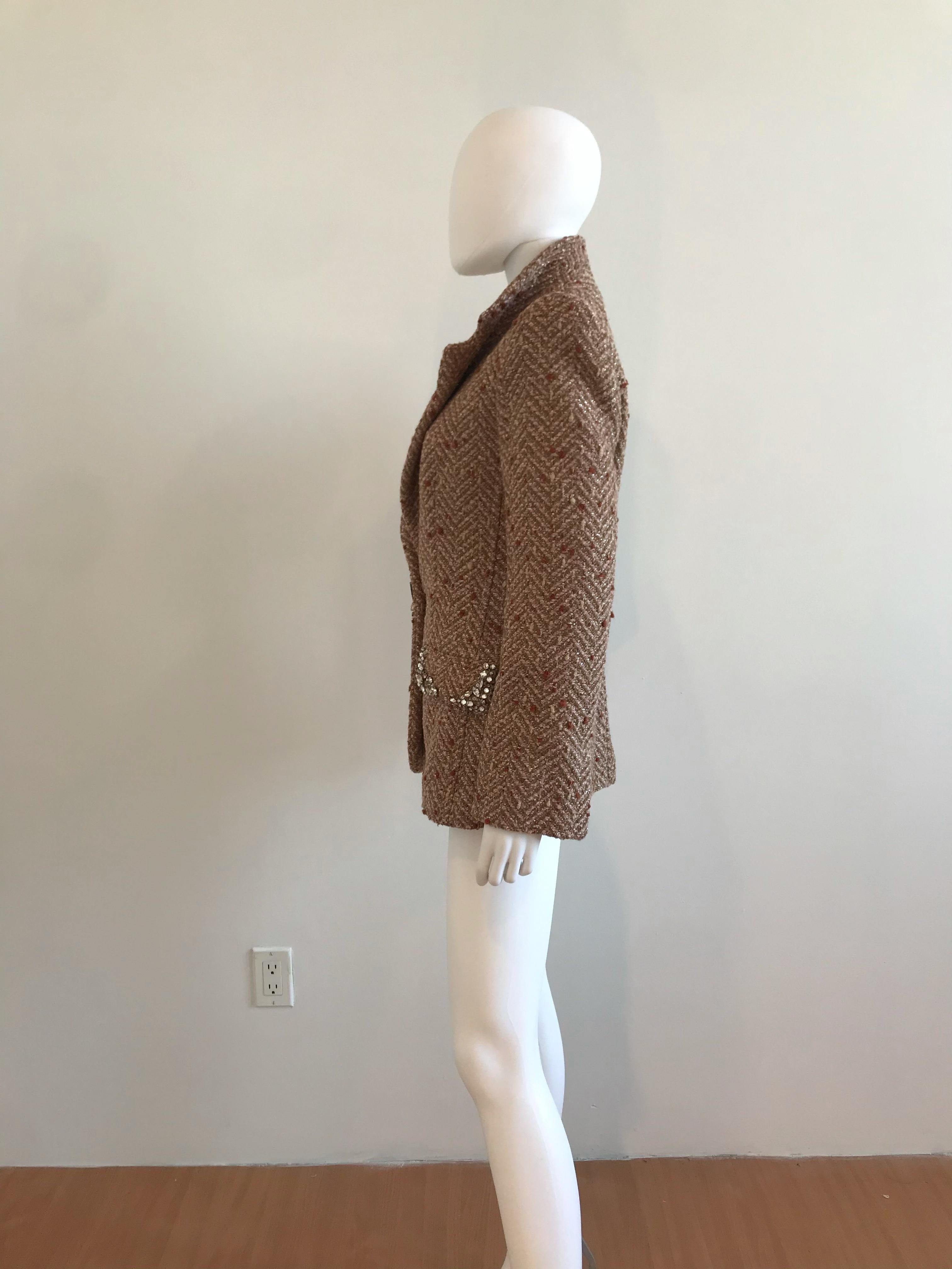 Gianfranco Ferre Boucle Blazer with Rhinestone Detailing on the pockets and front closure. Made in Italy. No size tag on the item but it is estimated to be approximately a size 4-6. Silk Lining.