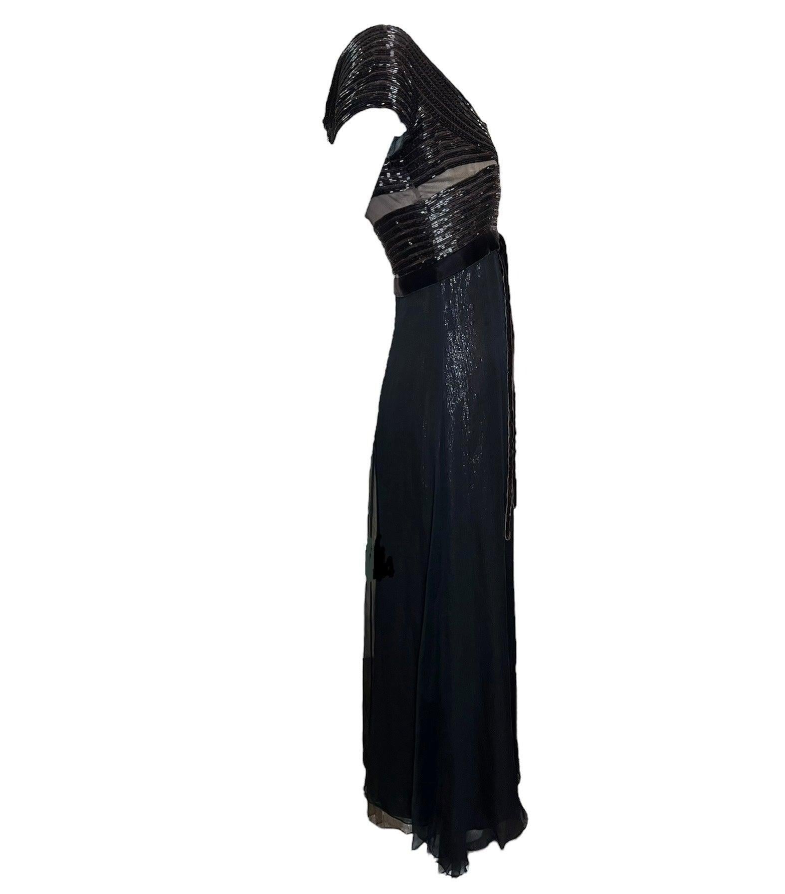Sparkling chocolate 1990s elegance! This gorgeous gown evokes charm and class with its gorgeous beaded bodice juxtaposed with sheer illusion cuts and sparkling silk body. Double layer silks with a sparkling brown layer under sheer black chiffon give