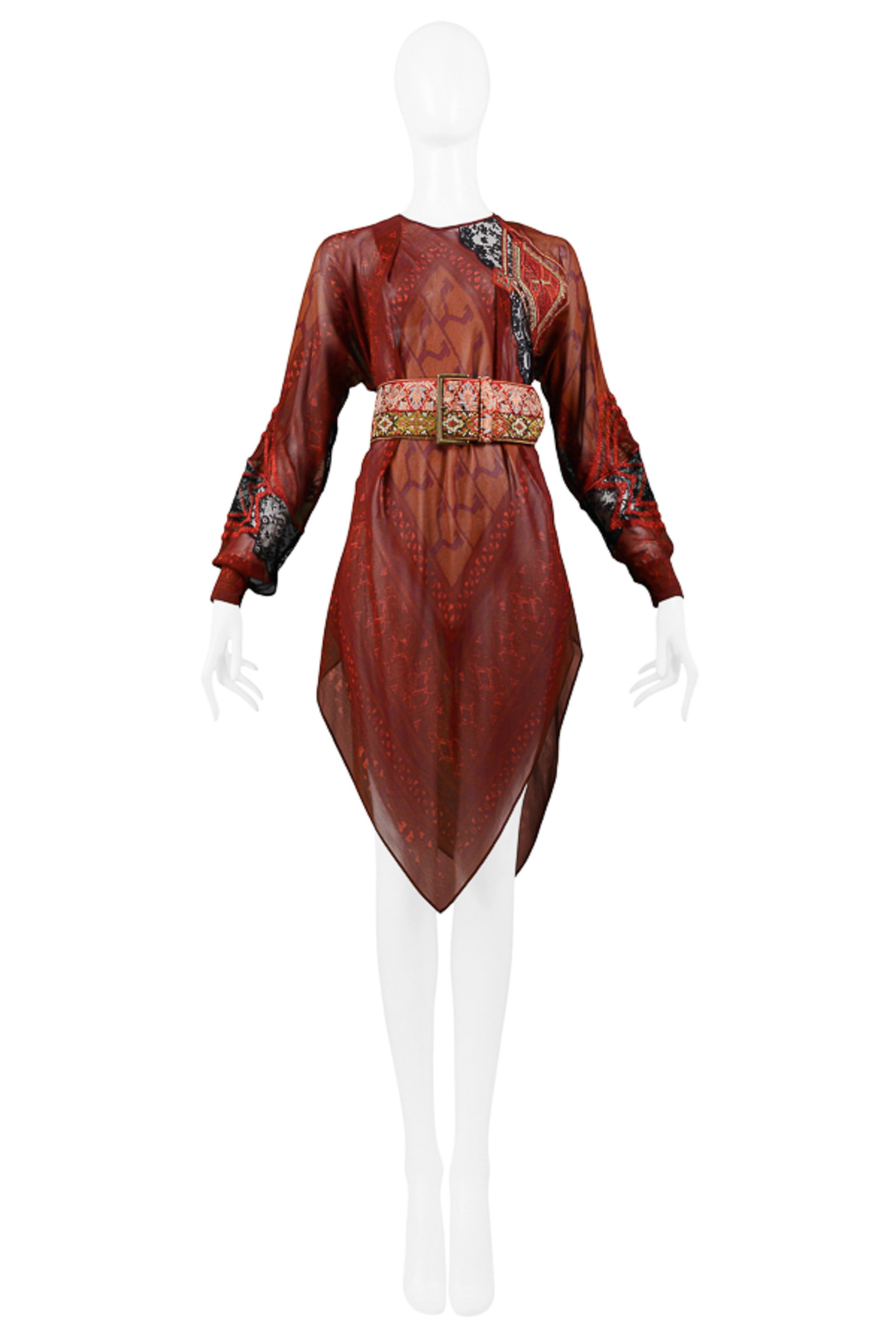 Resurrection Vintage is excited to offer a vintage Gianfranco Ferre burgundy and red silk tunic and belt featuring heavy embroidery, handkerchief hem, and keyhole back with button. The tunic comes with a wide embroidered belt that features a brass