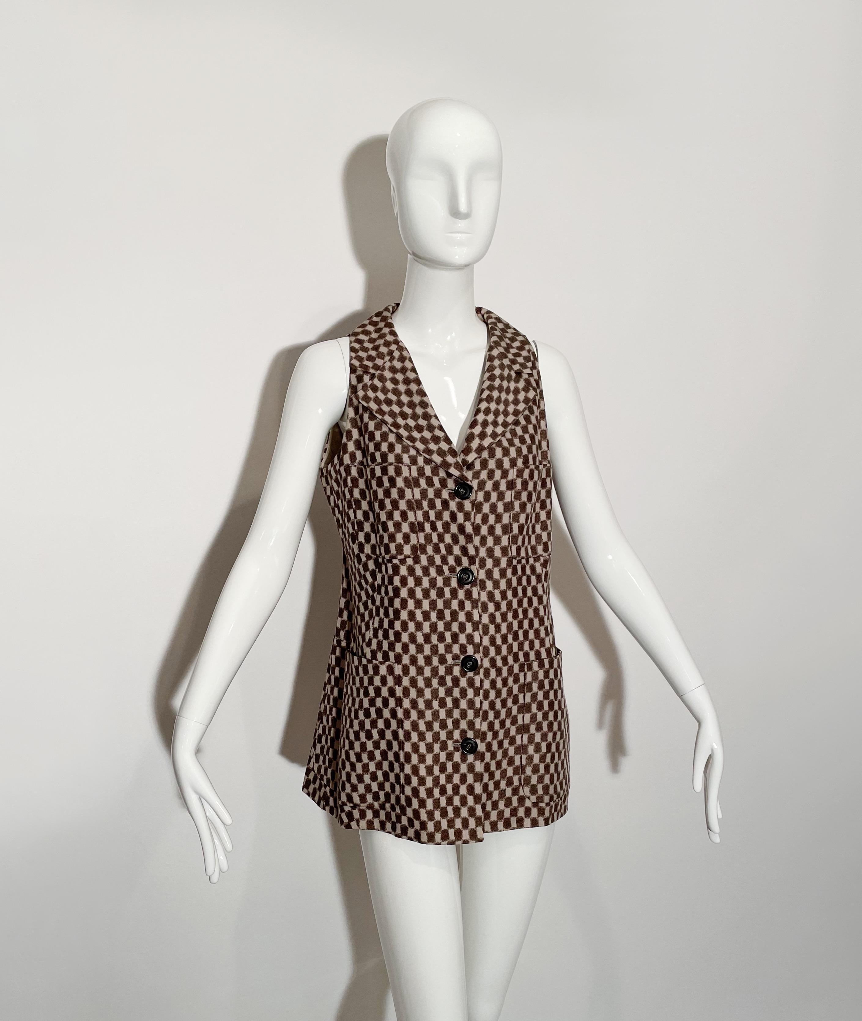 Brown and tan checkered vest. Lapel collar. Front button closures.  Pockets at chest and waist. Lined. Viscose. Made in Italy.

*Condition: excellent vintage condition. No visible flaws.


Measurements Taken Laying Flat (inches)—

Shoulder to