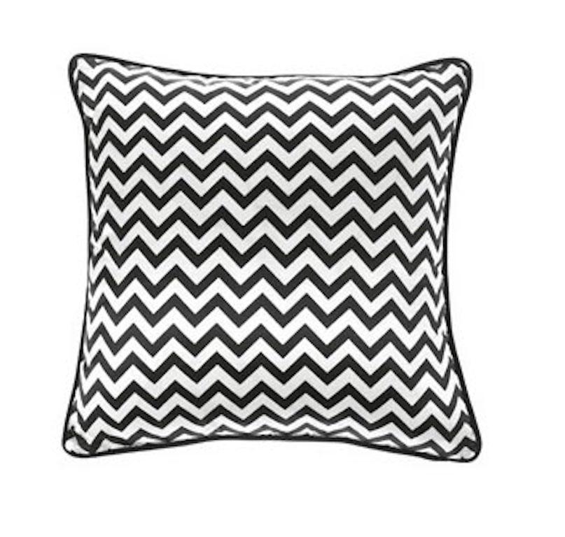 This pillow's chevron pattern and pop of color make it a playful addition to any space, working well atop any bed, armchair or sofa.

Cushions with chevron decoration printed on silk, back in velvet. Available in different colors (black, blue,