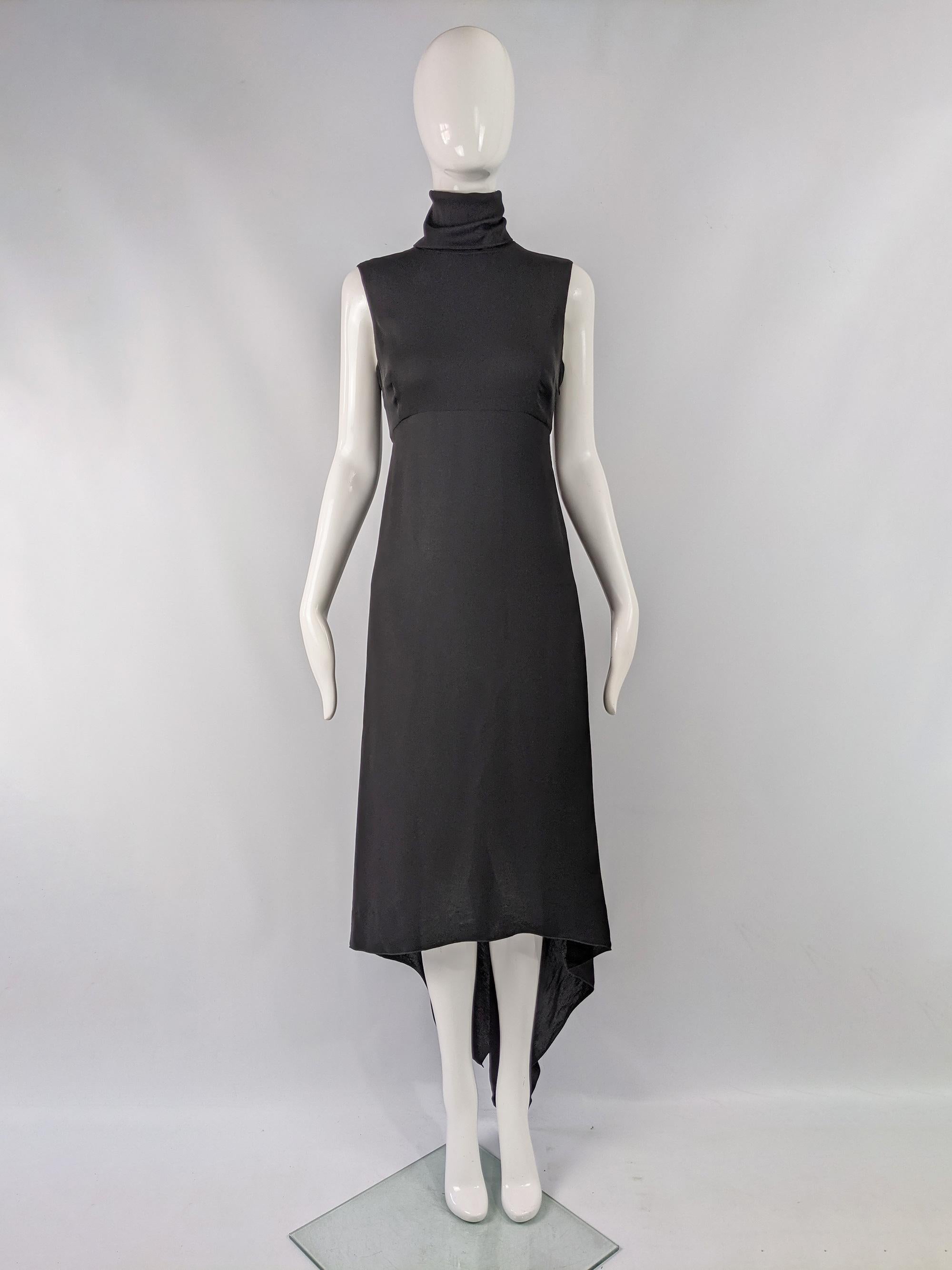 A fabulous vintage Gianfranco Ferré dress from the late 90s / early 2000s by luxury Italian fashion designer, Gianfranco Ferre. In a black silk blend chiffon with a layered and draped asymmetrical skirt, a high neck and sleeveless design. 

Size: