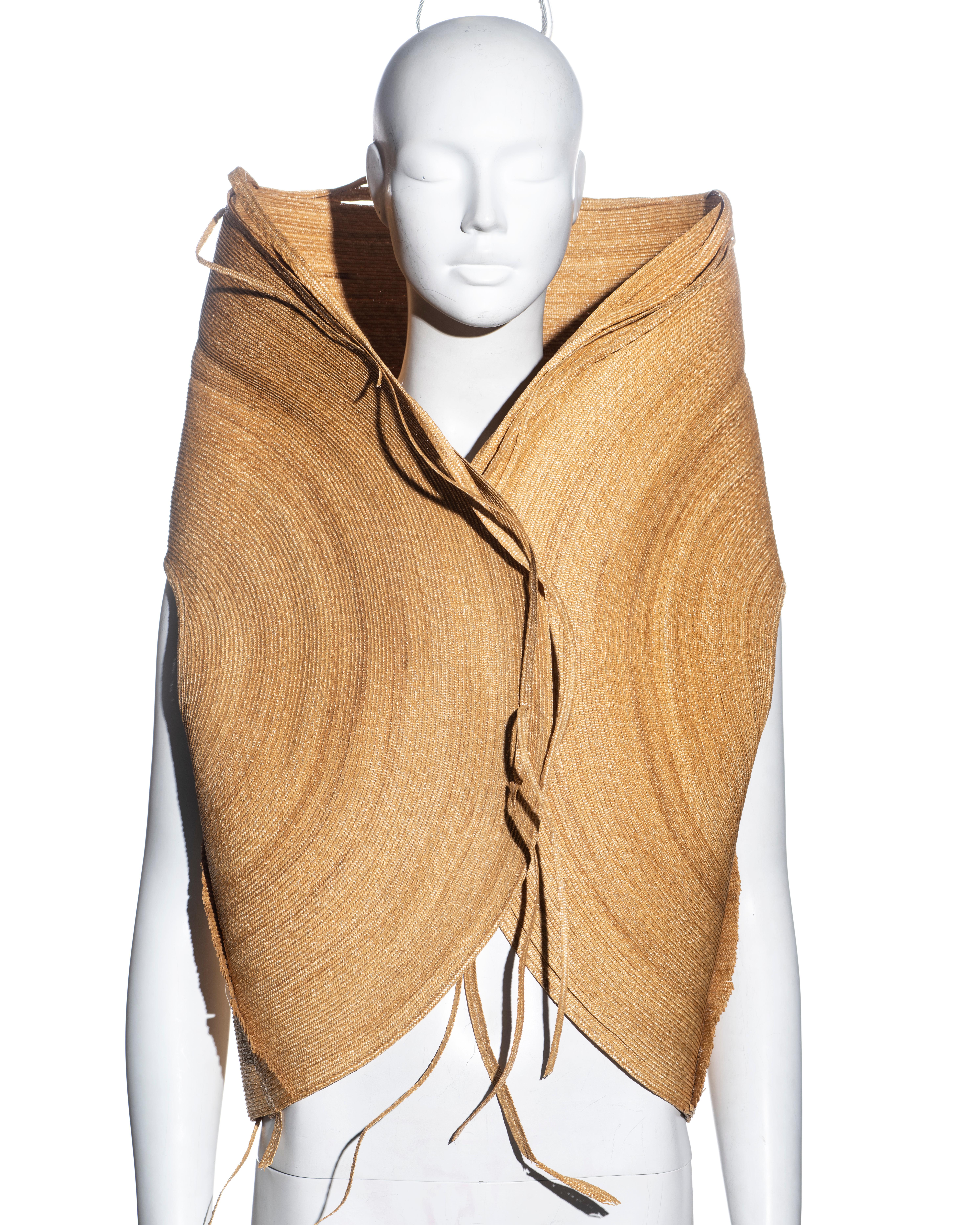 ▪ Gianfranco Ferre sleeveless jacket 
▪ Constructed from strands of straw 
▪ Large standing collar can be styled up or folded over 
▪ Snap buttons at the front opening 
▪ Singular straw strands around the edge convey a deconstructed look 
▪ Can be