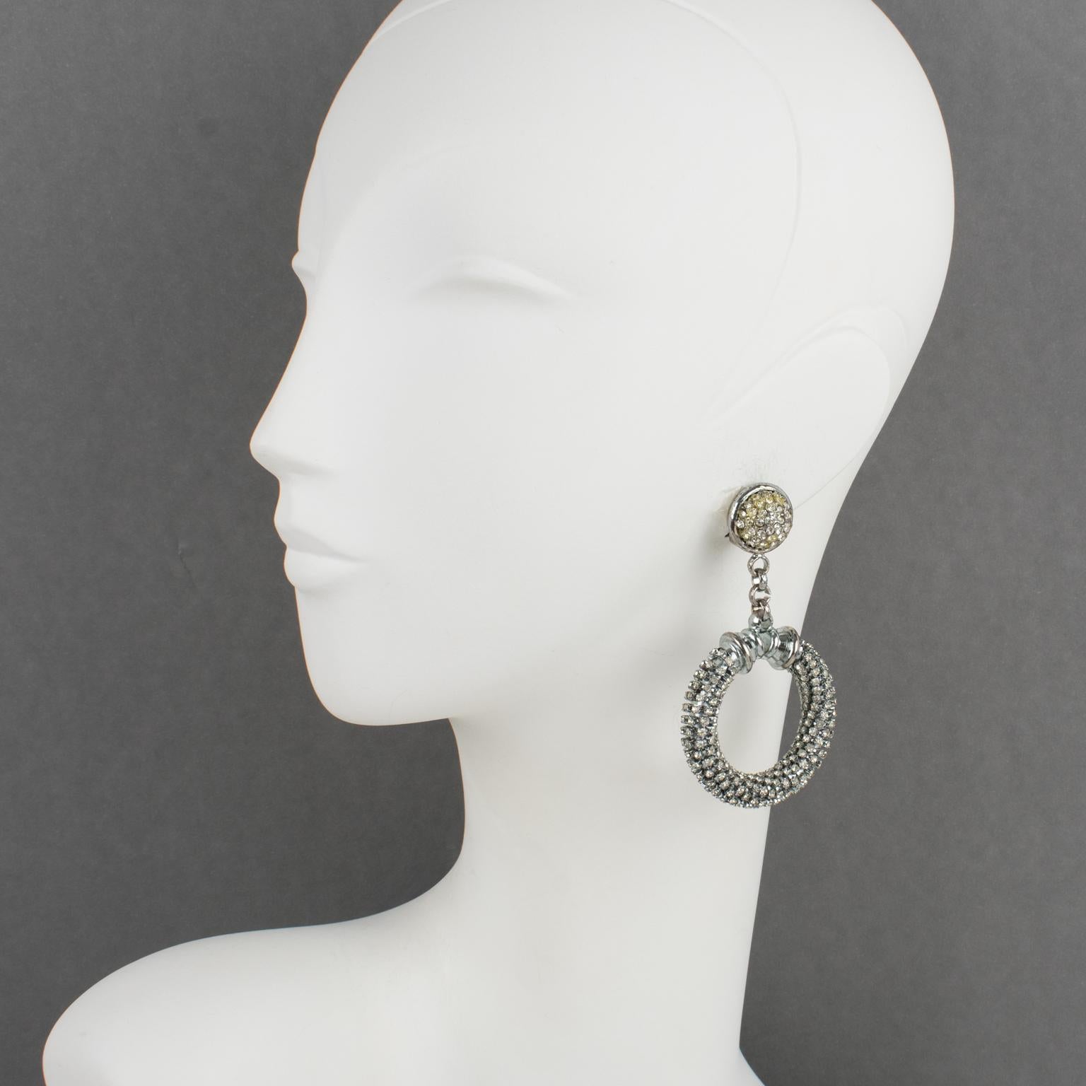Gianfranco Ferre, Italy, designed these eye-catching couture clip-on earrings. A statement shape built with a silvered metal doorknob or door knocker framing, all paved with tiny crystal rhinestones. The 