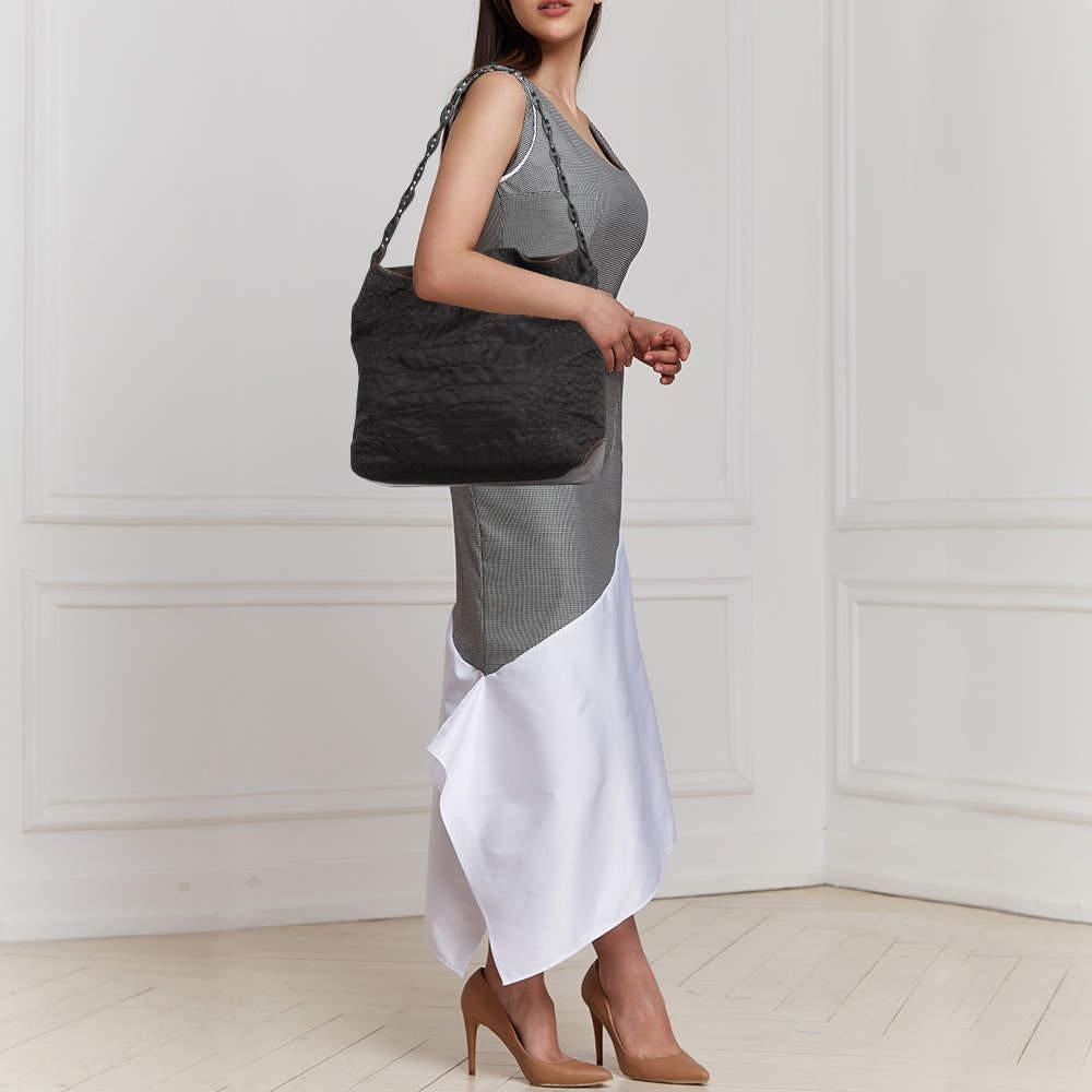 Thoughtful details high quality and everyday convenience mark this designer bag for women by Gianfranco Ferre. The bag is sewn with skill to deliver a refined look and an impeccable finish.