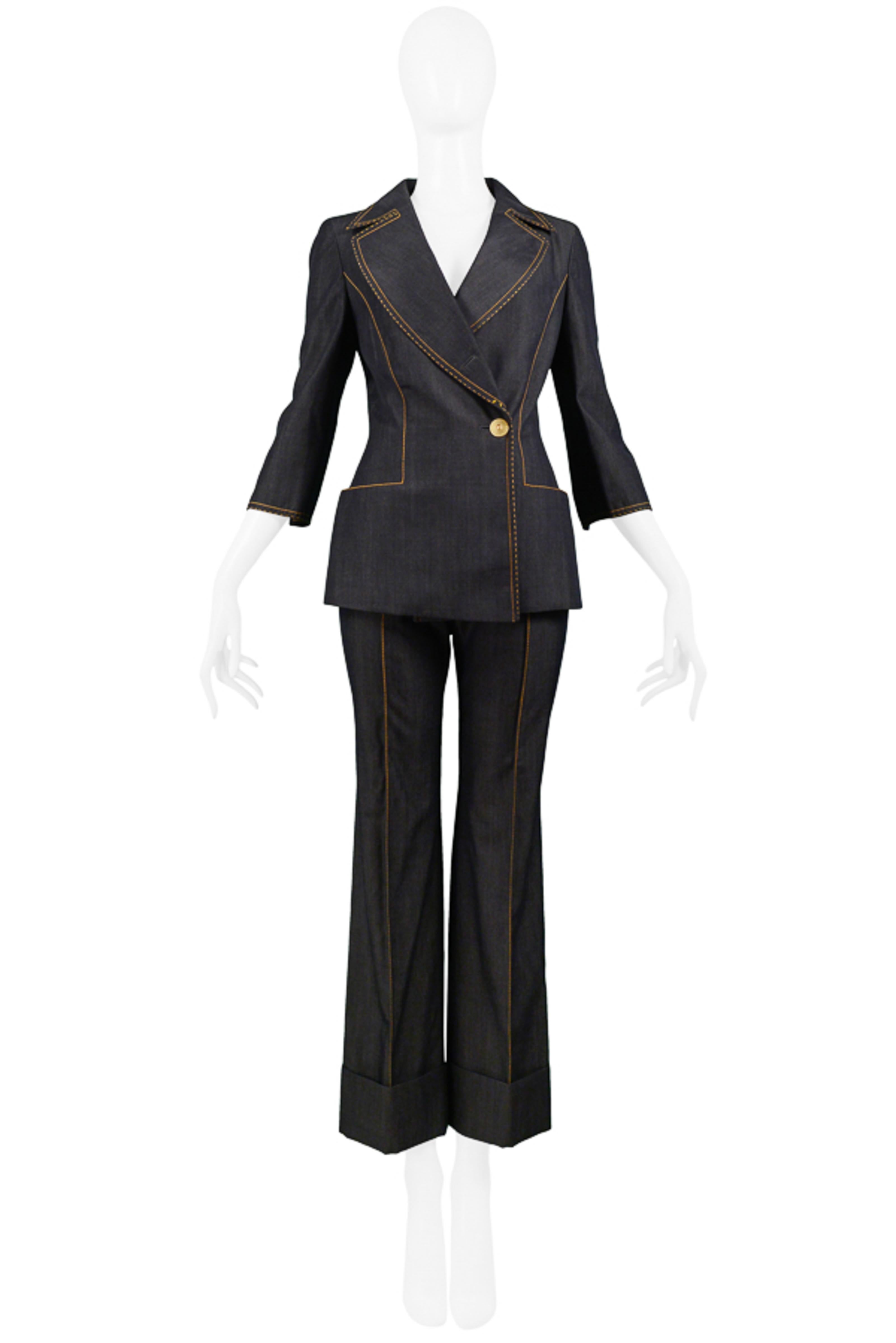 Resurrection Vintage is excited to offer a vintage Gianfranco Ferre denim-inspired suit featuring charcoal gray wool fabric, contrasting yellow stitching, a fitted blazer with asymmetrical button closure, 3/4 sleeves, notch collar with wide lapels,