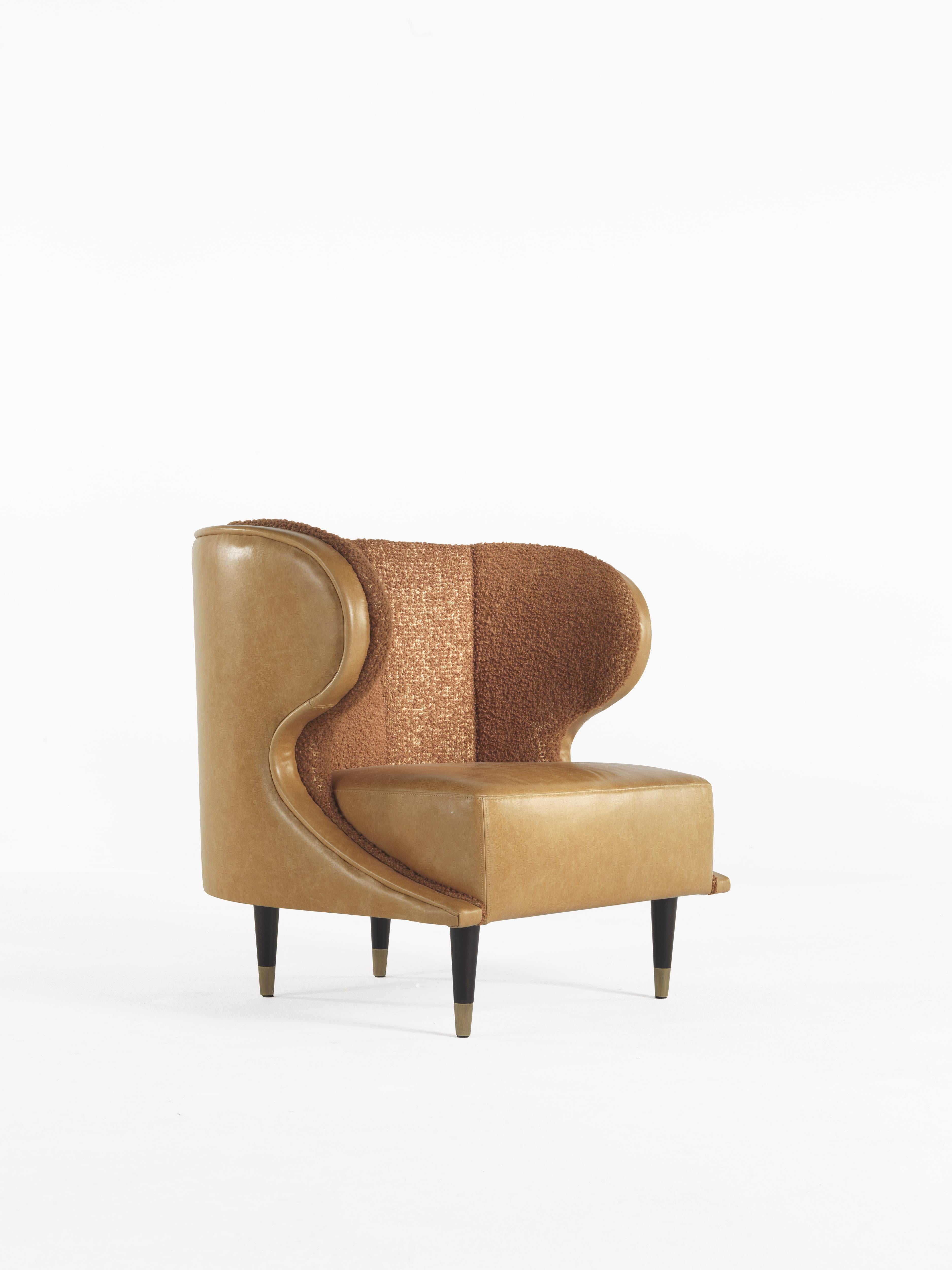 The midcentury charm meets comfort and design in this armchair designed for reading and relaxation, ideal for the sleeping area. Its soft lines and enveloping backrest recall in its shape a classic bergère but with the modern touch of the legs with