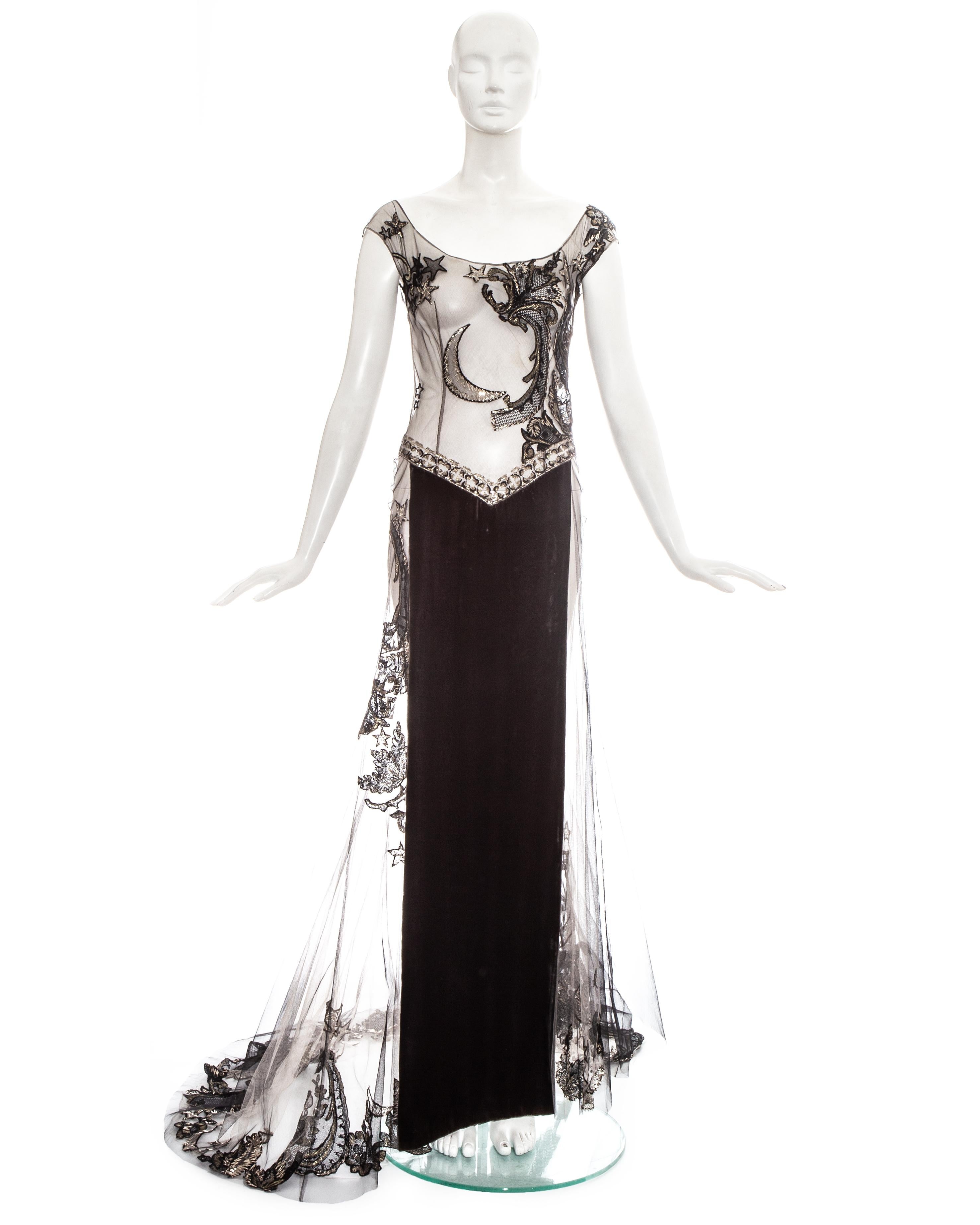 Gianfranco Ferré couture embroidered tulle evening gown, WITH metal-strip worked crescent moon, stars and arabesques, skirt with velvet central front panel and trained hem and concealed zip fastening. 

Fall-Winter 1998