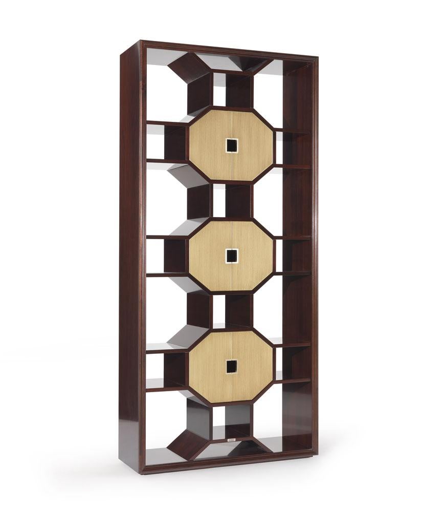 Asian Charm embellished with new, precious details. In the Eva_1 bookcase, the geometric shapes are exalted by the bronze finish doors, ensuring a captivating and spectacular final result.

Structure in beech wood, mahogany finishing. Doors in